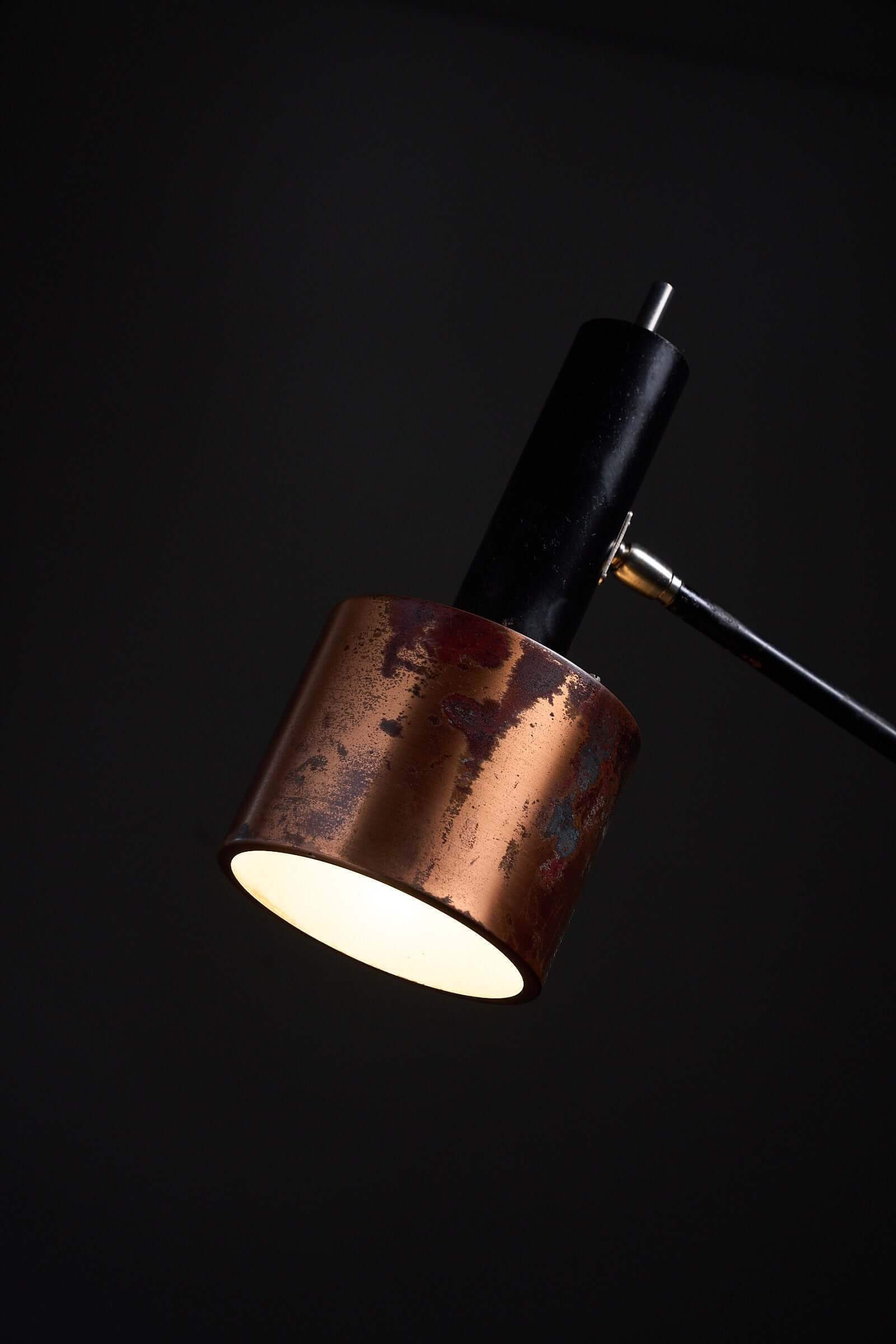 Floor lamp in black steel and copper shade, 1970s with warm, organic patina and sculptural design.