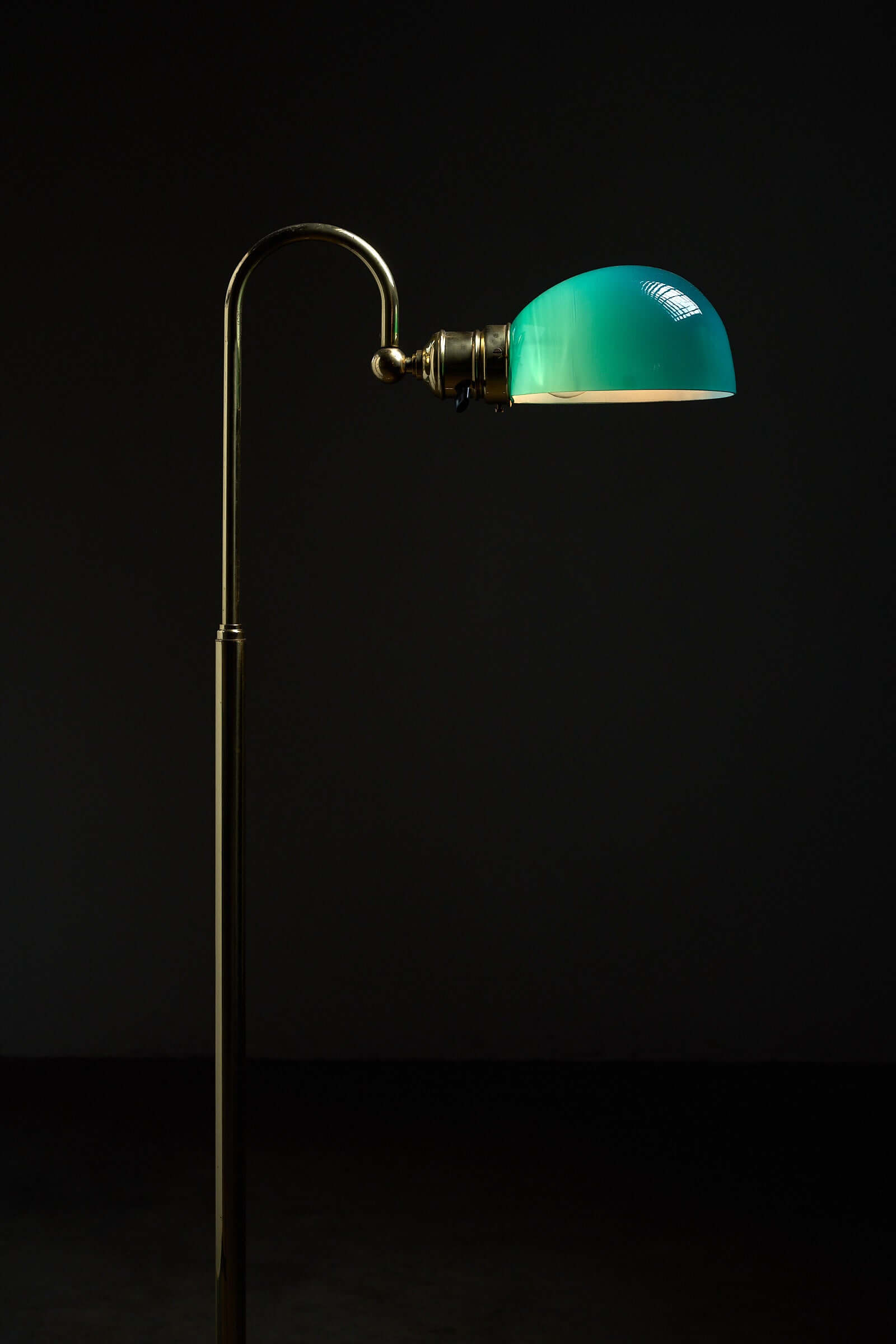 Floor lamp in brass with green glass shade, 1970s showcasing elegant design and vintage charm.