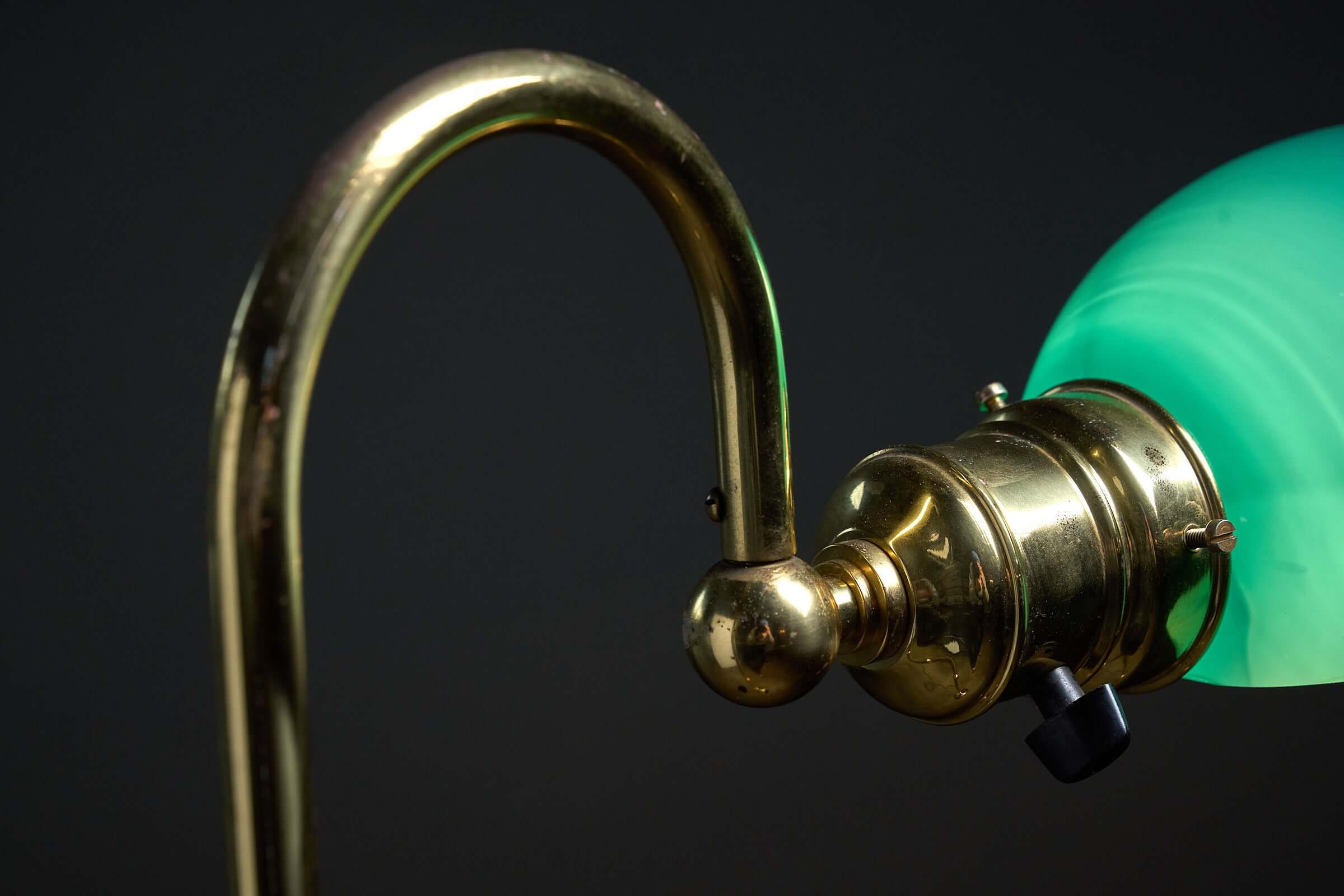 Floor lamp in brass with green glass shade, 1970s showcasing a brass arm and elegant green shade.