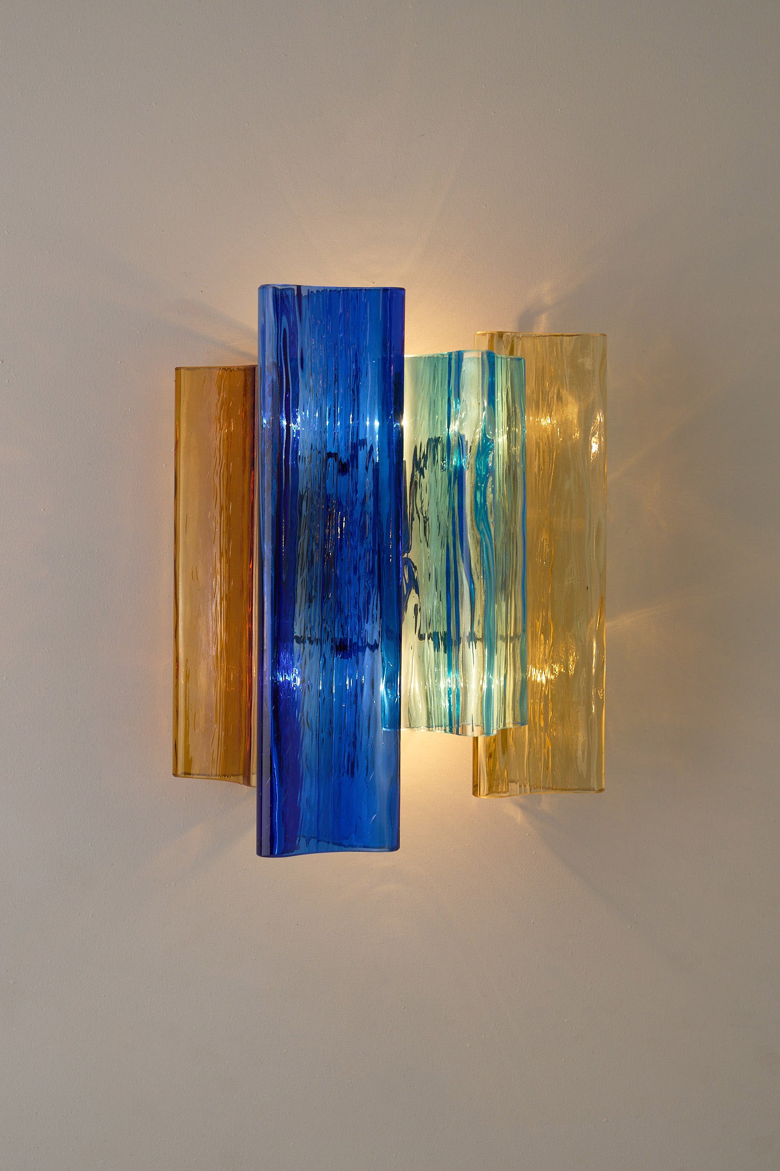 Unique pair of multicolor Murano glass wall lamps by Salviati & Co., Italy, circa 1970s with blue, amber, and aqua tones.