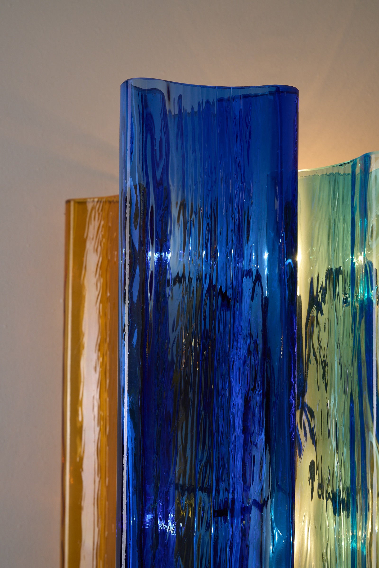 Unique pair of multicolor Murano glass wall lamps by Salviati & Co., Italy, circa 1970s, in blue, amber, and aqua.