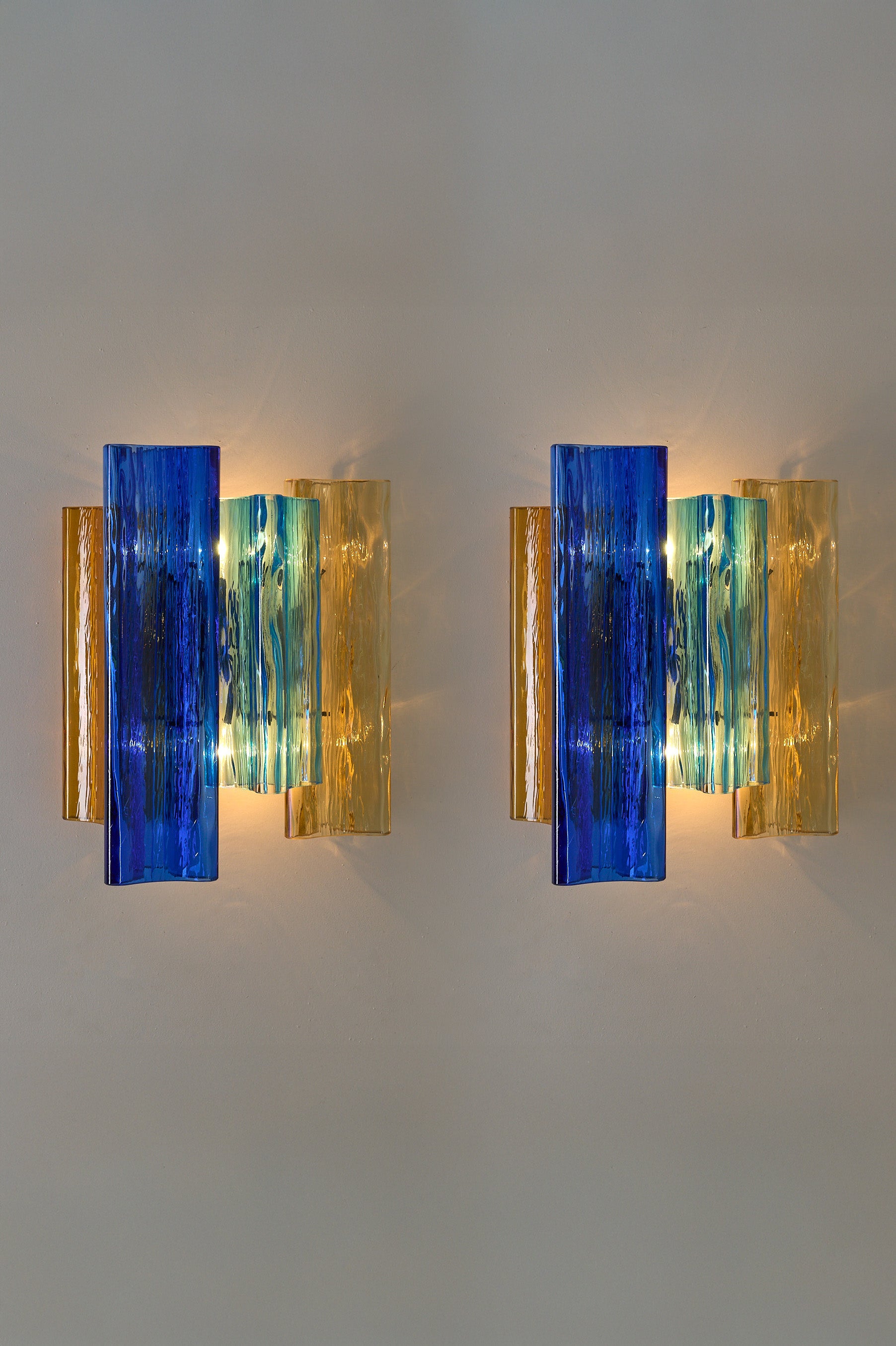Unique pair of multicolor Murano glass wall lamps by Salviati & Co., Italy, circa 1970s.