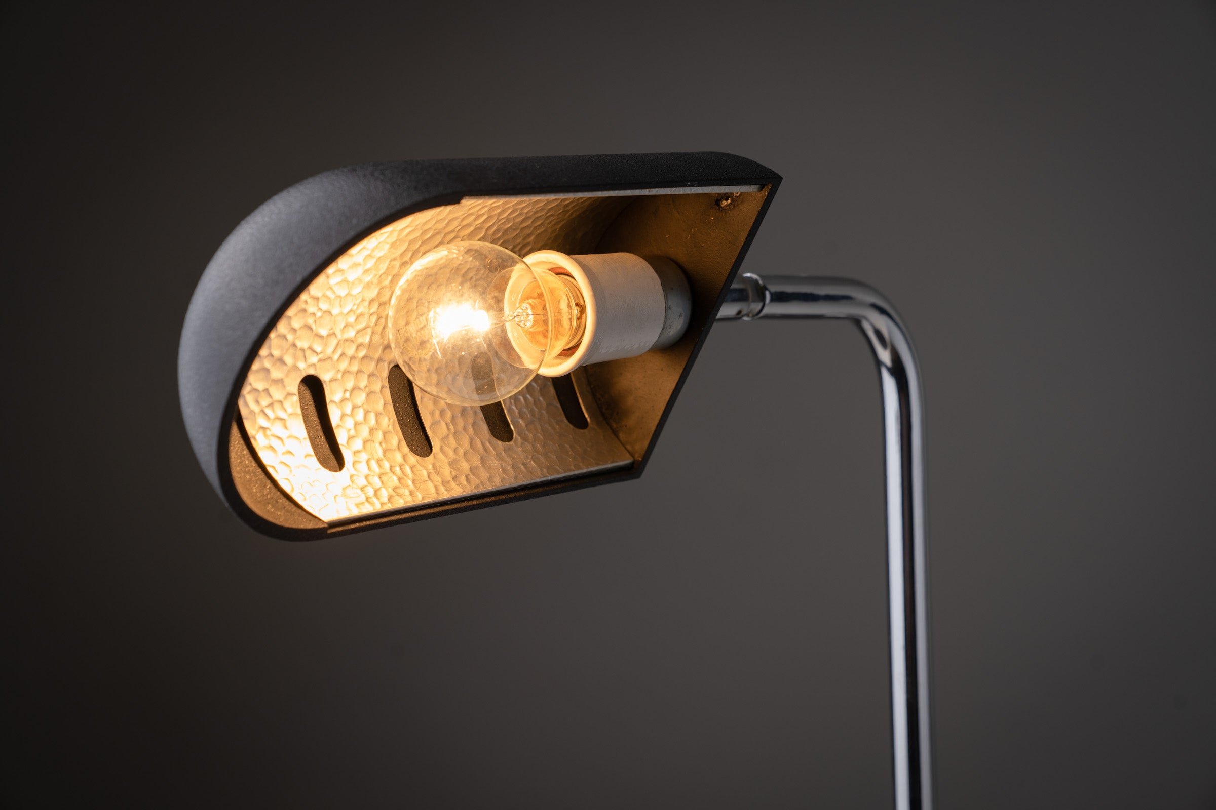 Detail of the adjustable "Snodo" table lamp by Sergio Mazza, Italy, 1970s highlighting its black lacquer shade and chromed stem.