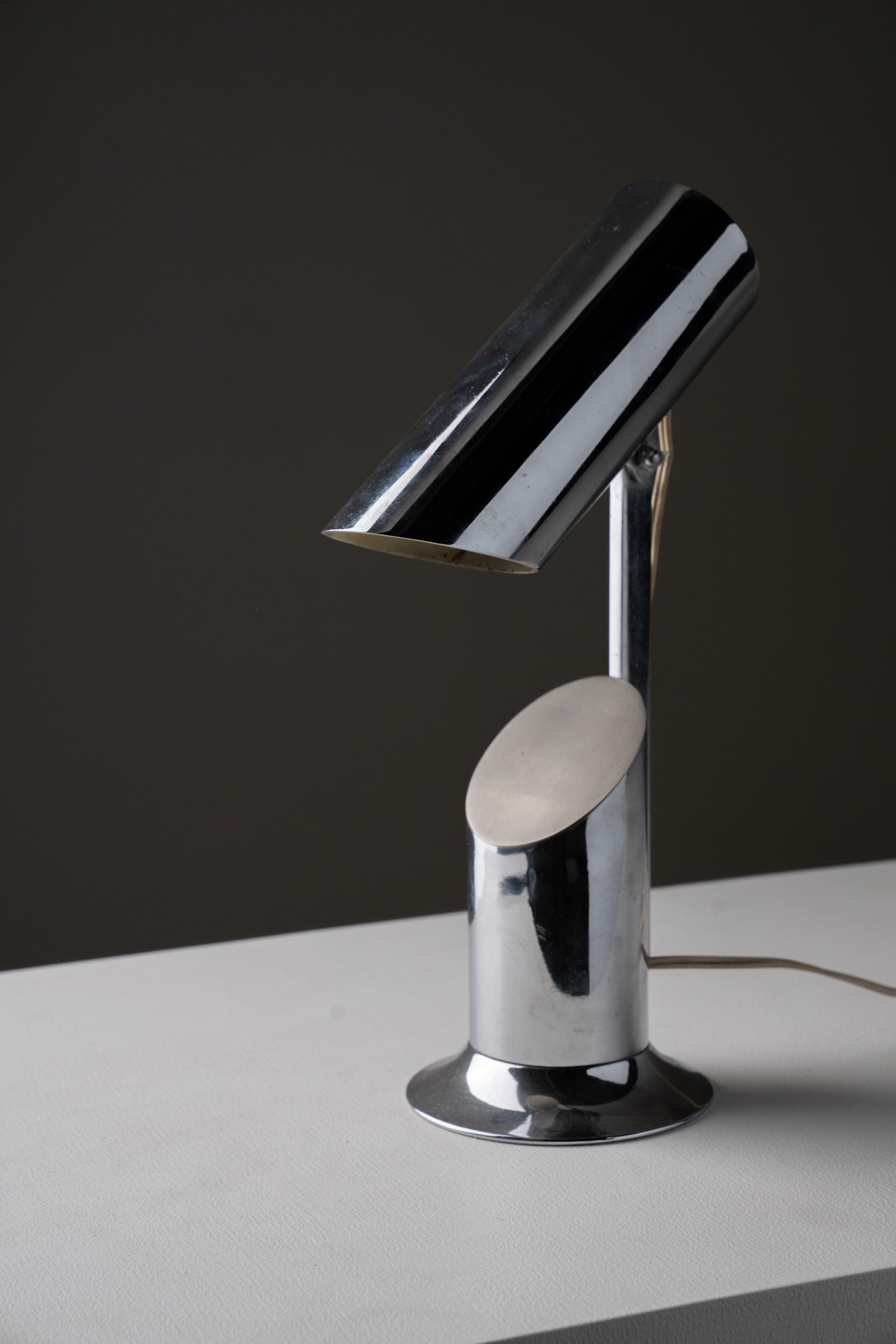 Italian Cylindrical Table Lamp in Polished Chrome with Adjustable Shade, 1970s on a white surface.