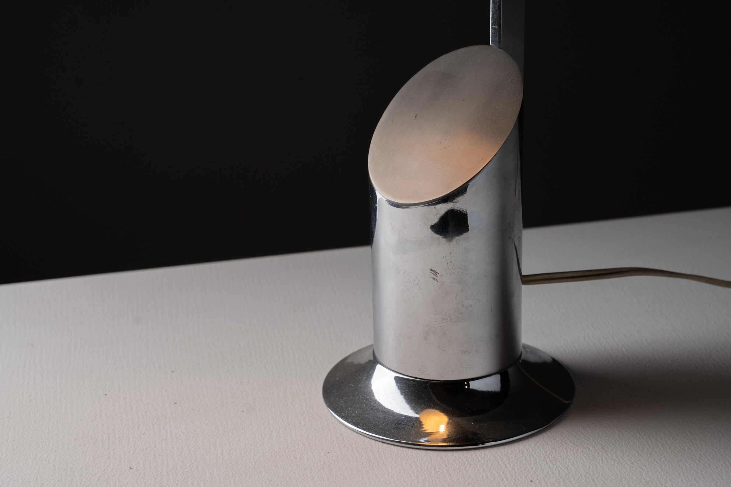 Italian Cylindrical Table Lamp in Polished Chrome with Adjustable Shade, 1970s on a surface with soft lighting.