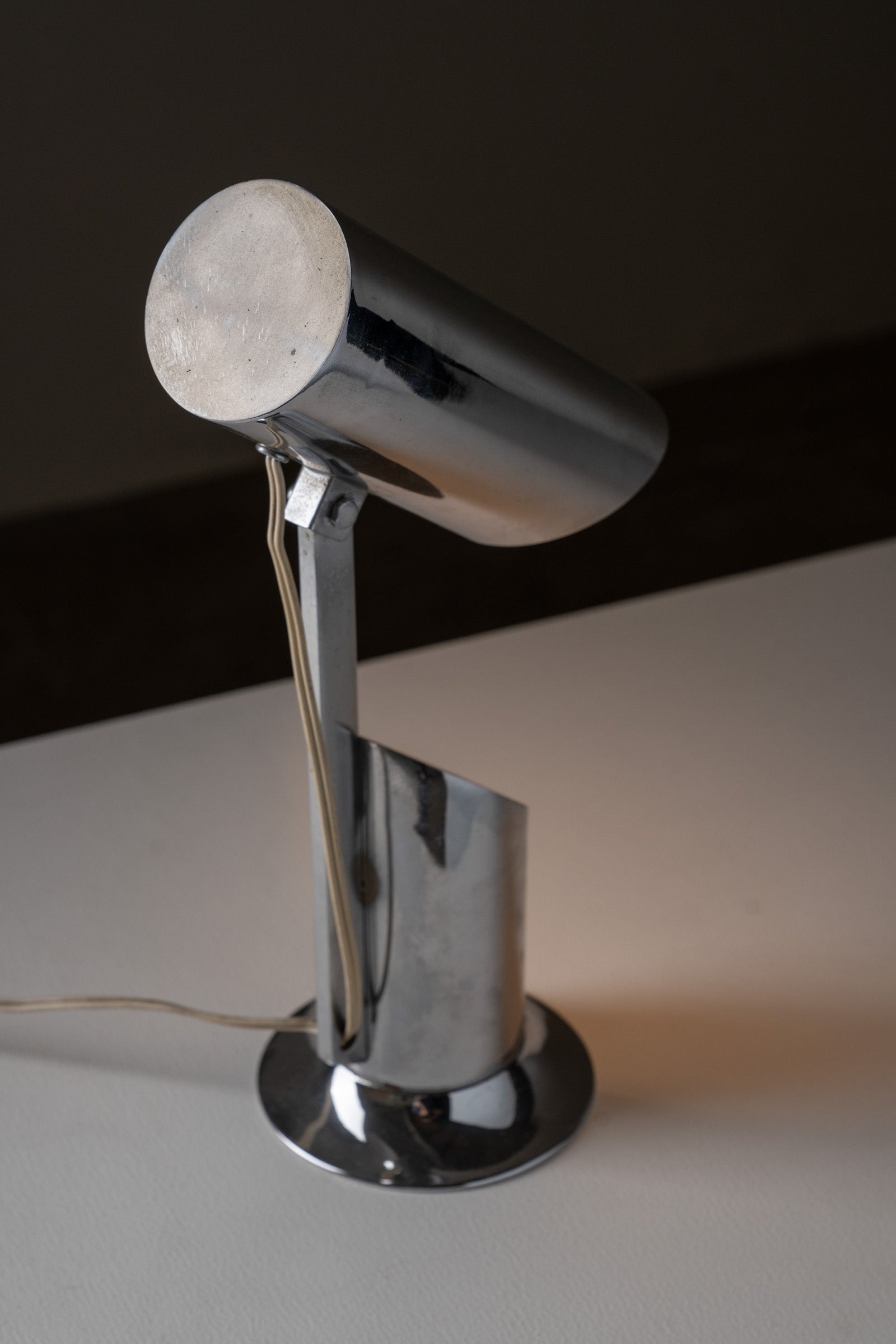 Italian Cylindrical Table Lamp in Polished Chrome with Adjustable Shade, 1970s on a white surface.