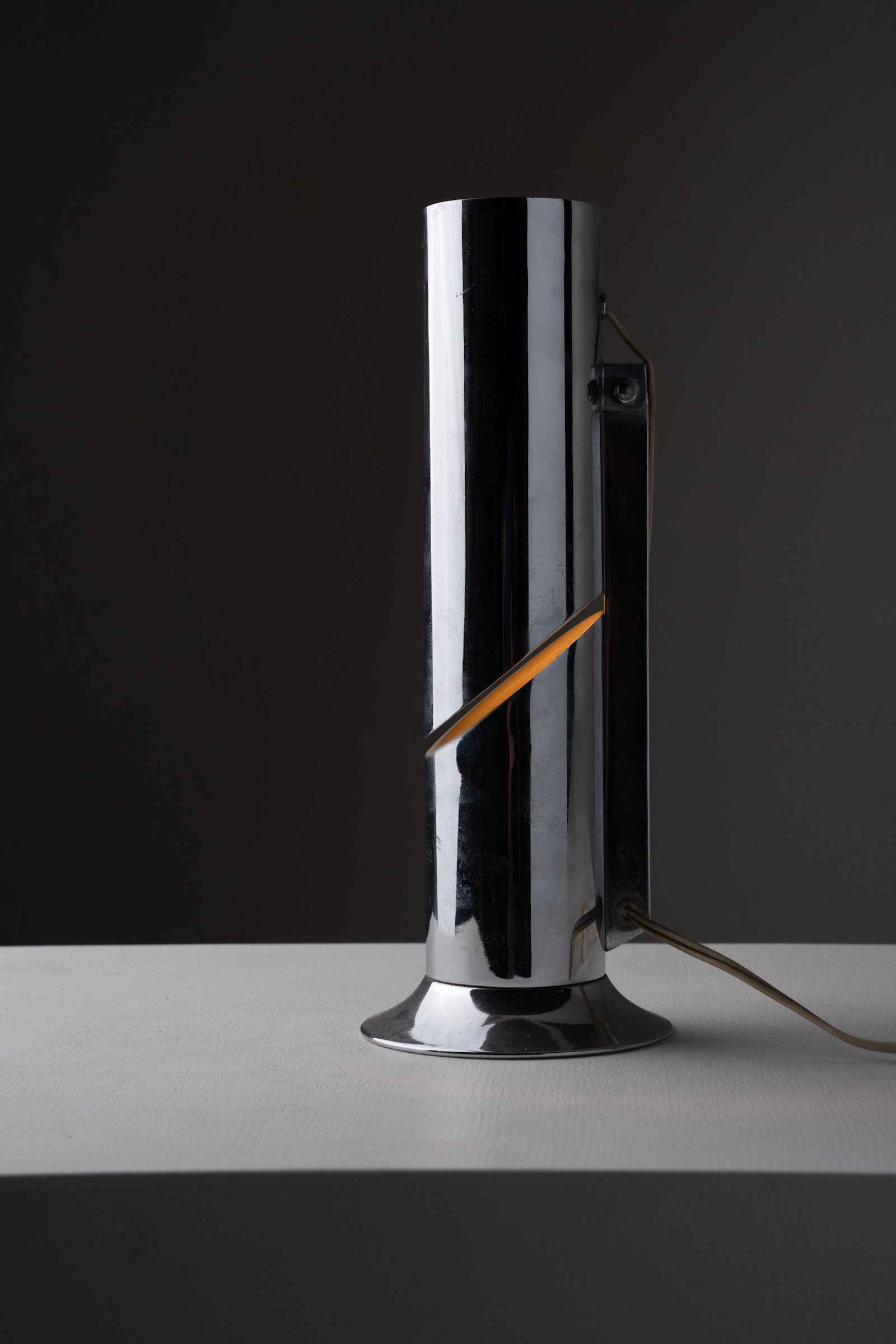 Italian Cylindrical Table Lamp in Polished Chrome with Adjustable Shade, 1970s on a white table.