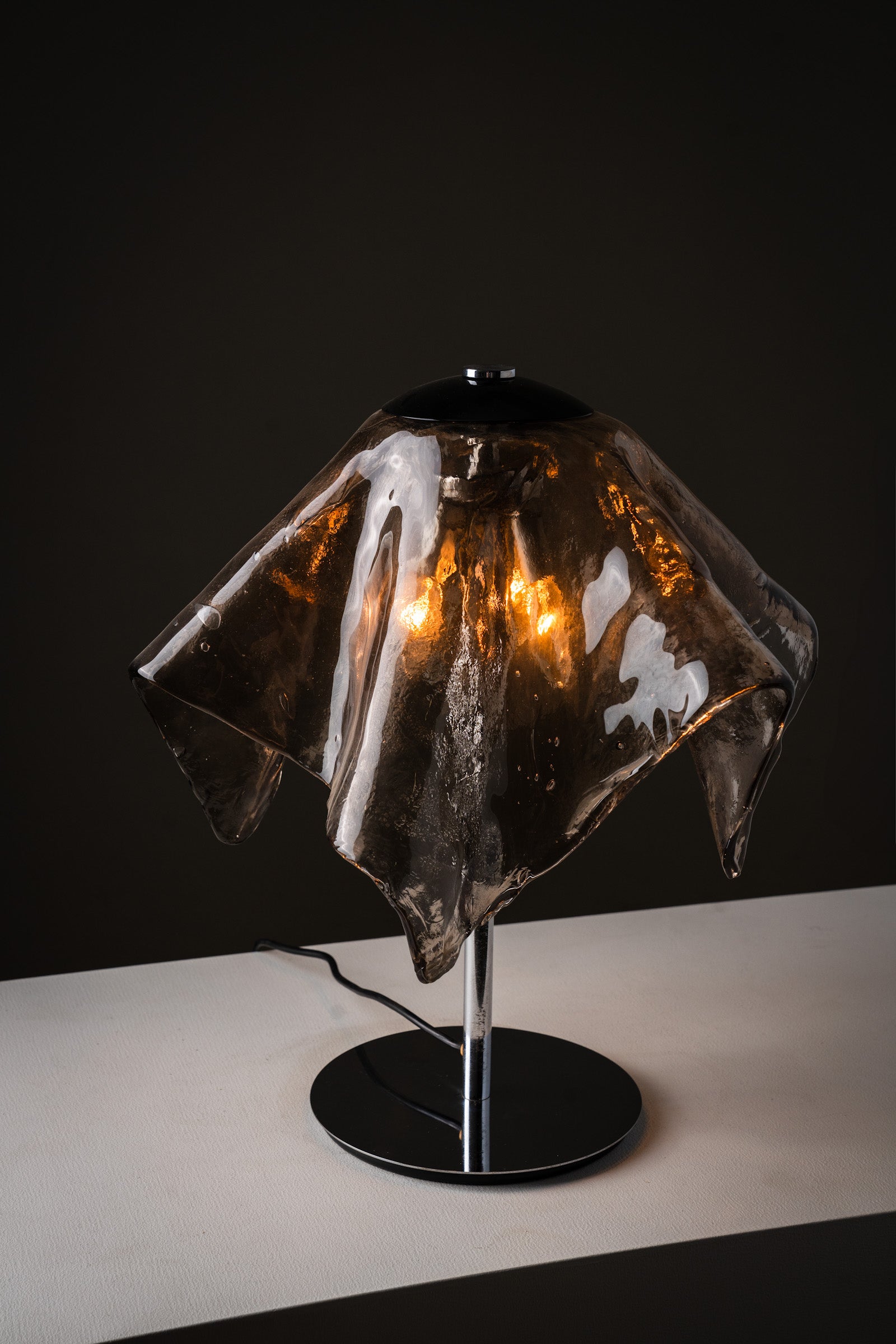 Carlo Nason for Mazzega Fazzoletto Table Lamp, 1970s, featuring hand-blown smoked glass shade and chrome base.