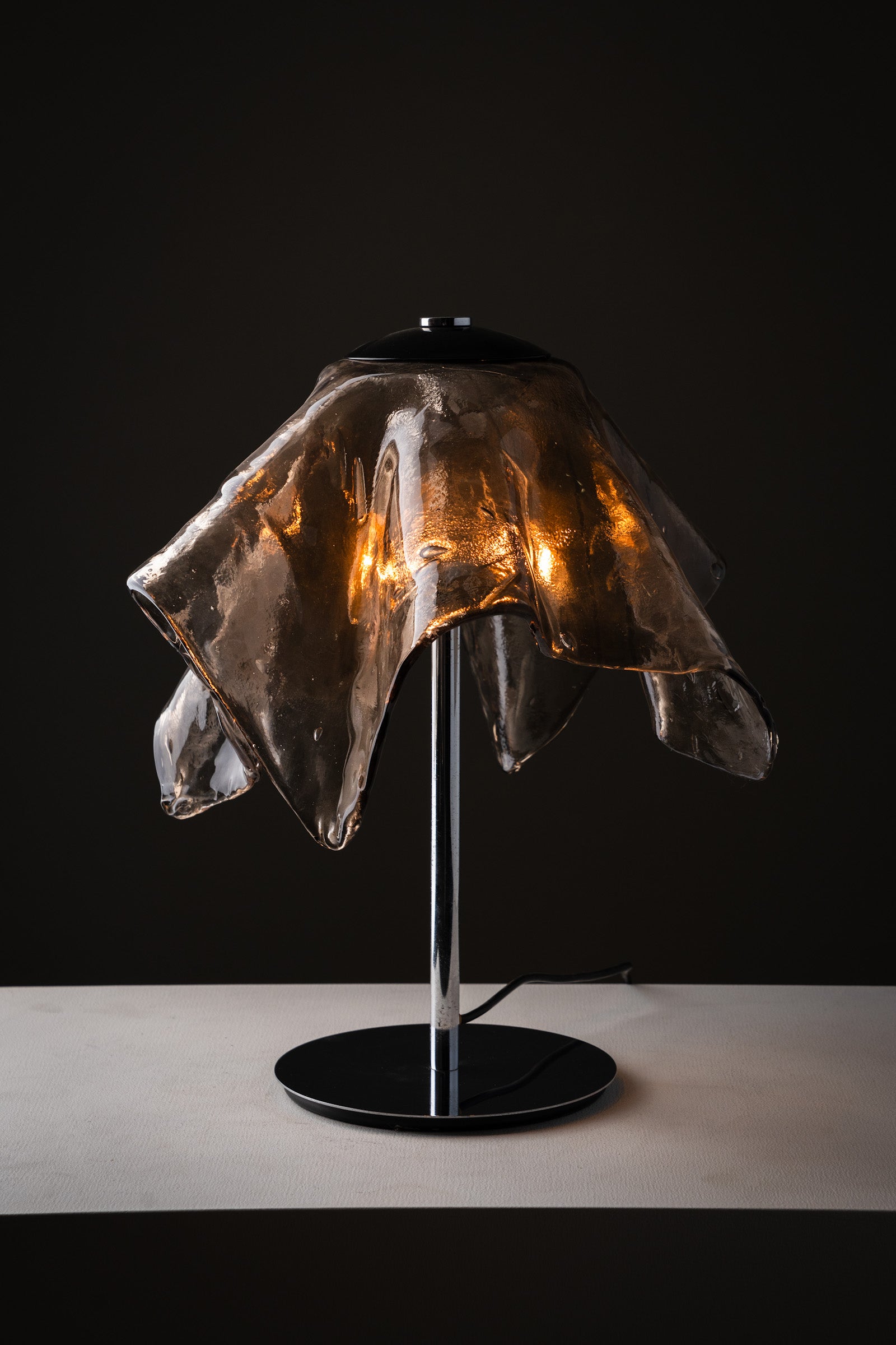 Carlo Nason for Mazzega Fazzoletto Table Lamp, 1970s featuring a hand-blown smoked glass shade.