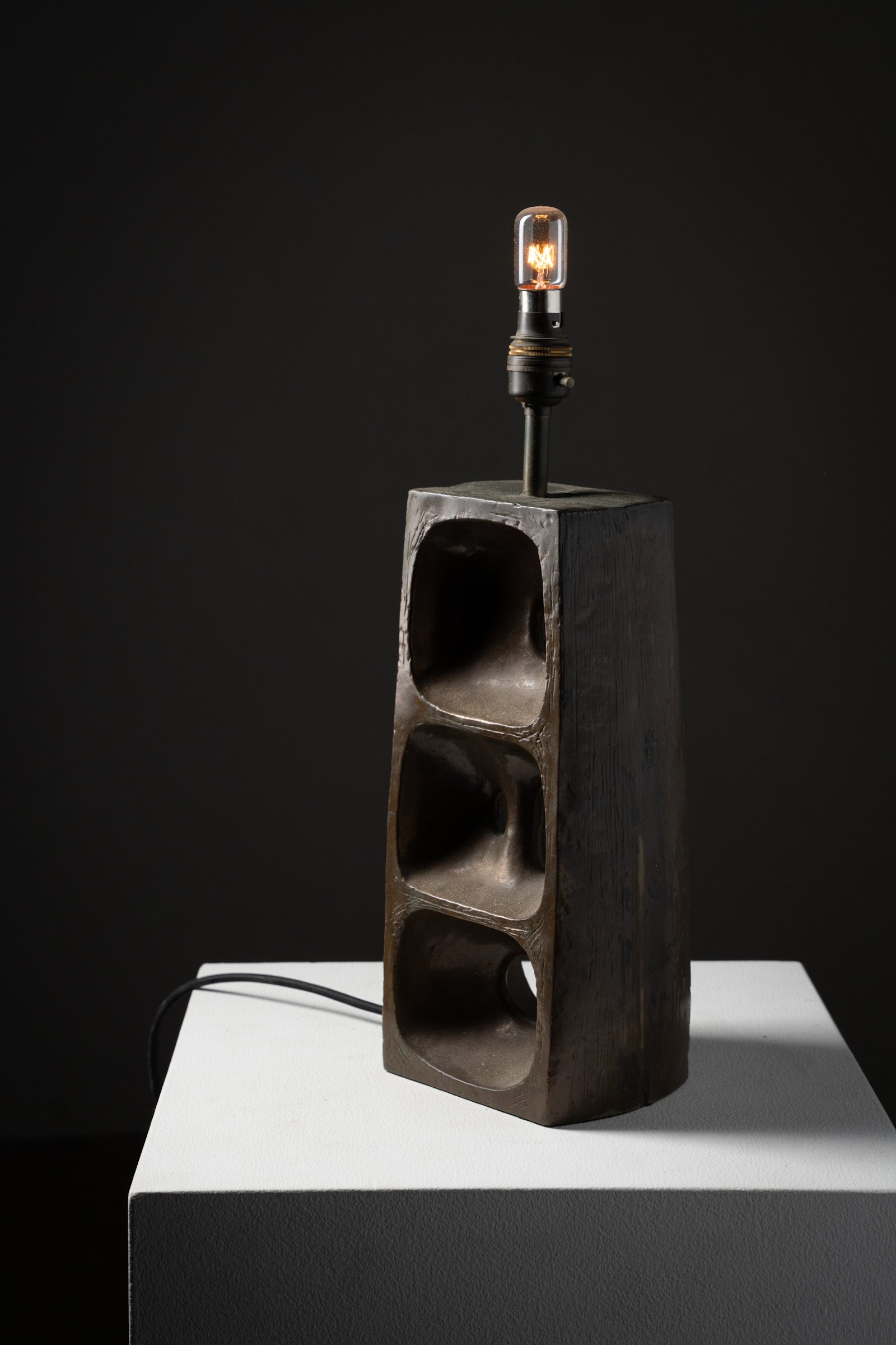 Brutalist Ceramic Table Lamp, 1970s with bronzed ceramic base and geometric design on display.