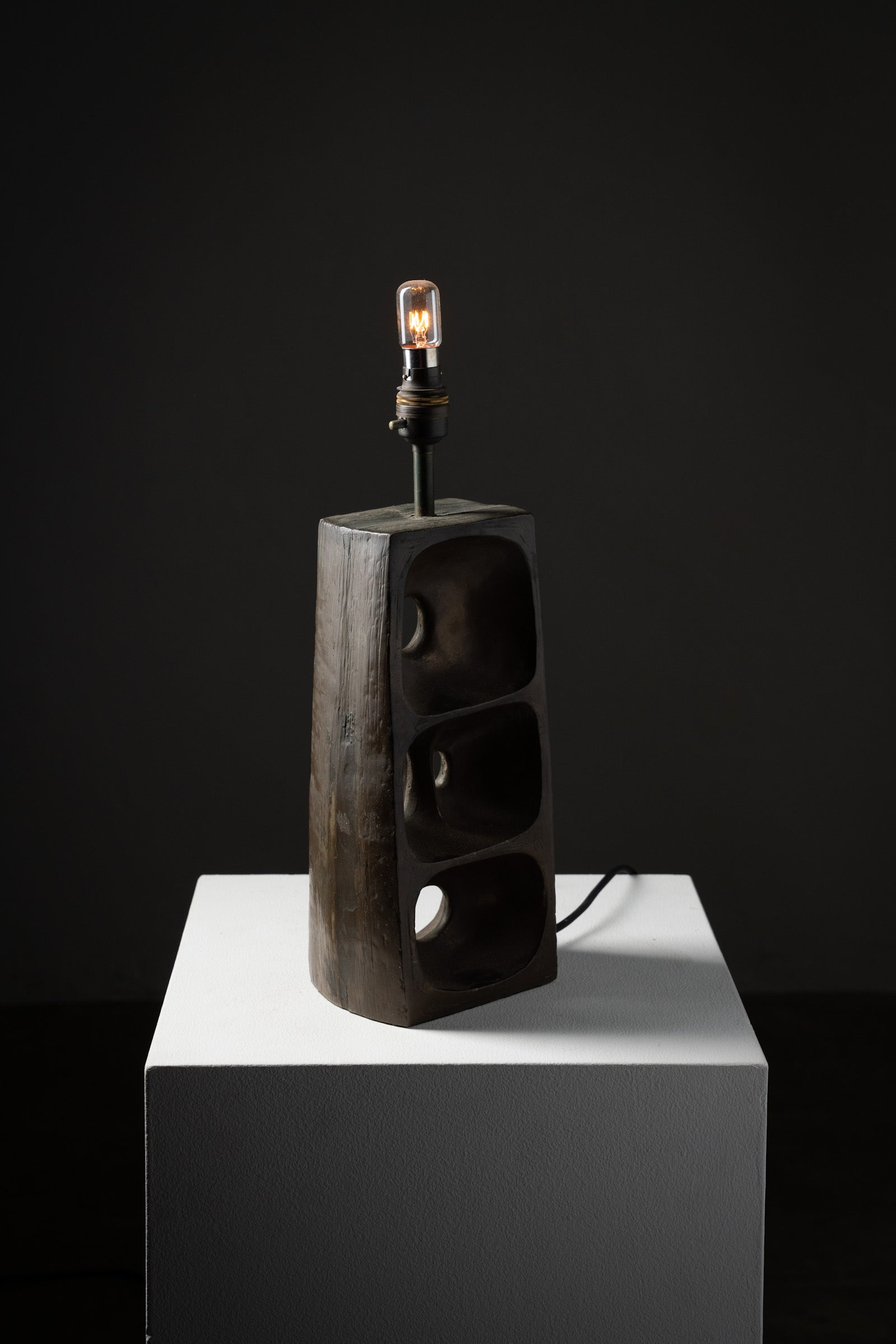 Brutalist Ceramic Table Lamp, 1970s on display with open geometric form and textured surface.