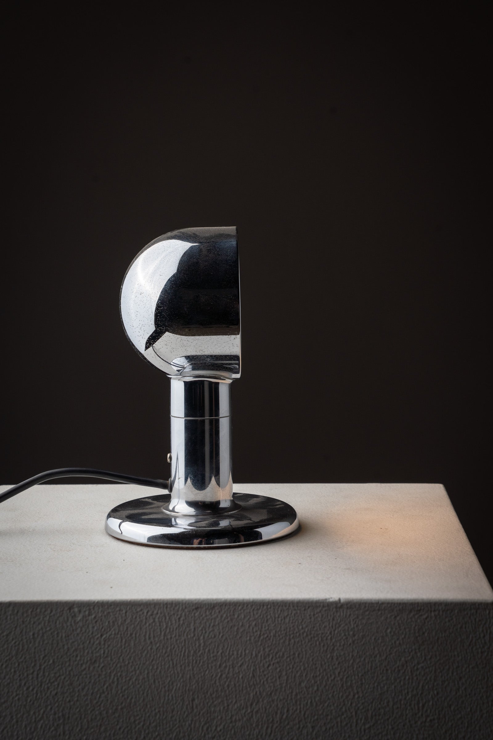 Small Space Age Chrome Table Lamp, 1970s on a pedestal, showcasing its sleek chrome design and semi-spherical shade.
