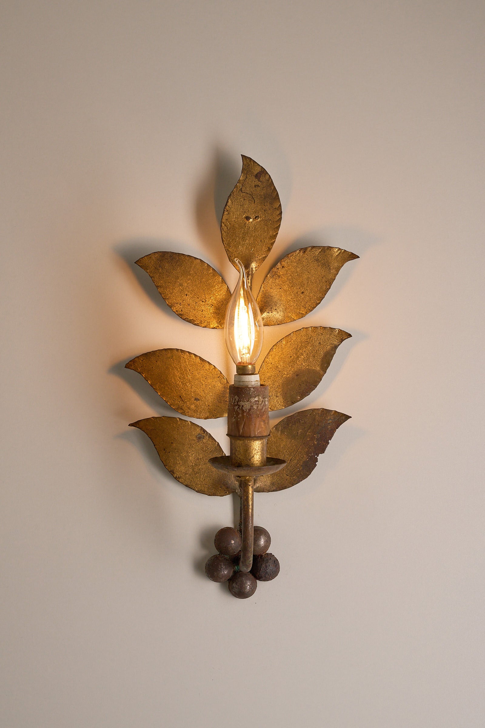Brass Leaf Wall Sconce, 1920s with hand-shaped leaves and soft patina, showcasing mid-century craftsmanship.