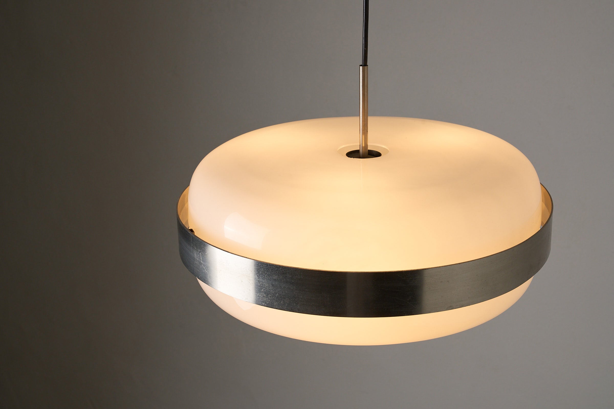 Artiforte H1018 Ceiling Lamp in Opaline Acrylic and Brushed Nickel, 1970s showcasing its circular design and warm illumination.