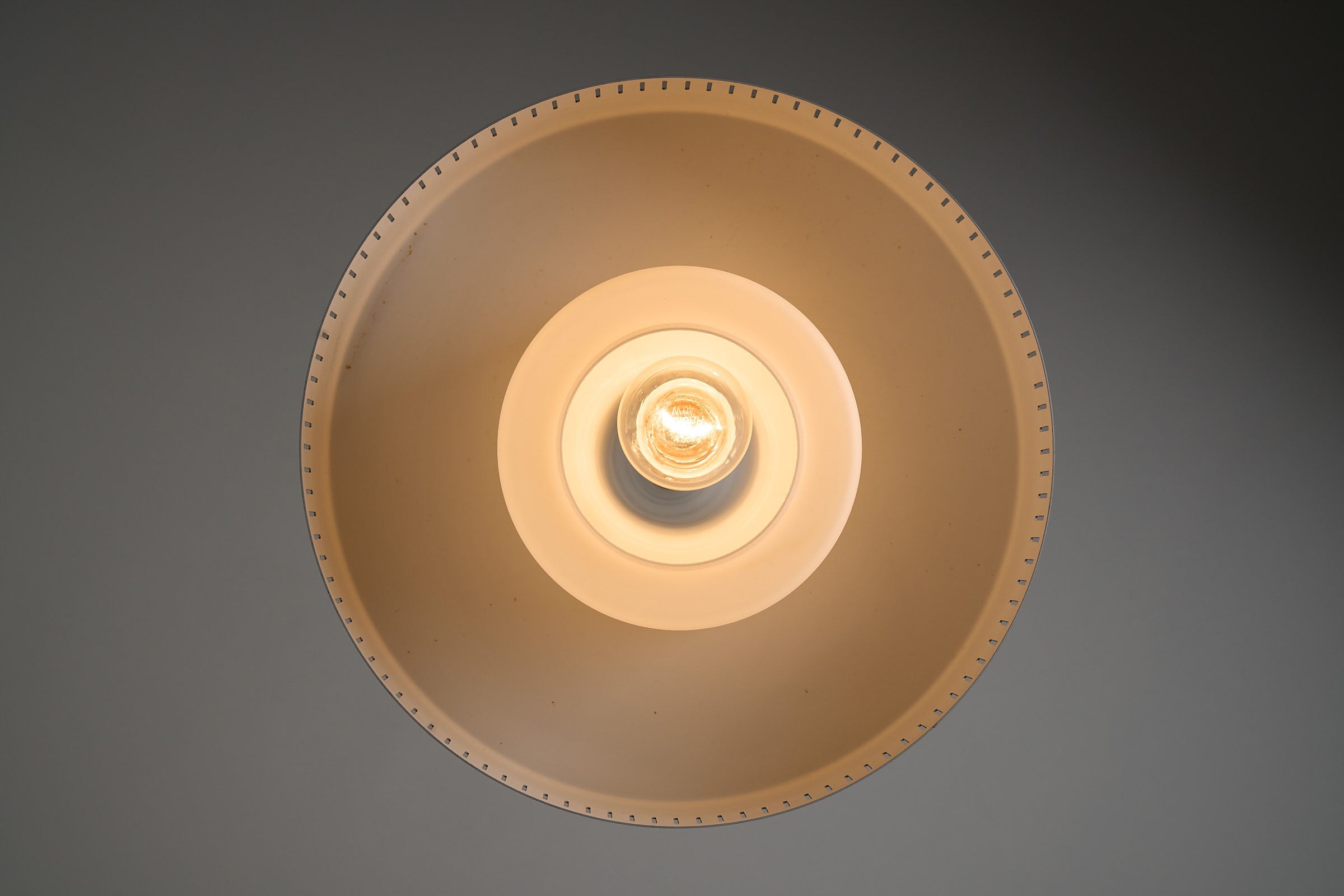 Pendant Lamp by Bent Karlby for Fog & Mørup, Denmark, 1960s from above showcasing opaline glass and caramel metal shade.