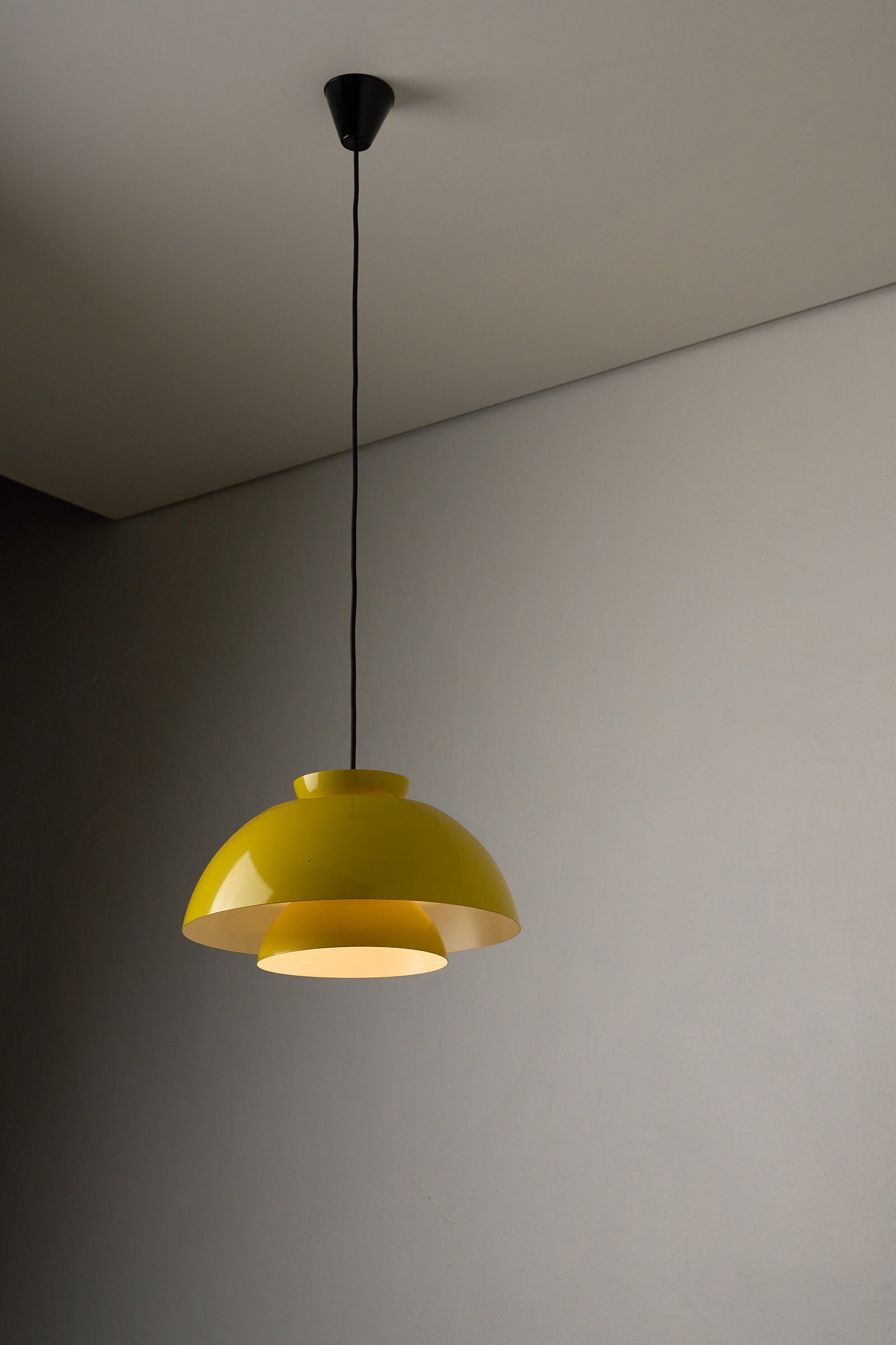 Fog & Mørup Yellow Metal Pendant Lamp, Denmark, 1960s hanging lamp with triple shades providing warm illumination.