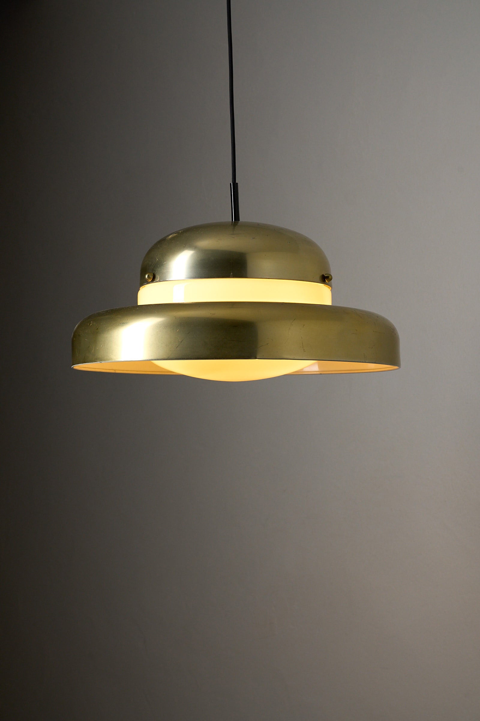 Large Brass and Yellow Glass Pendant showcasing mid-century modern design with a soft yellow glow.