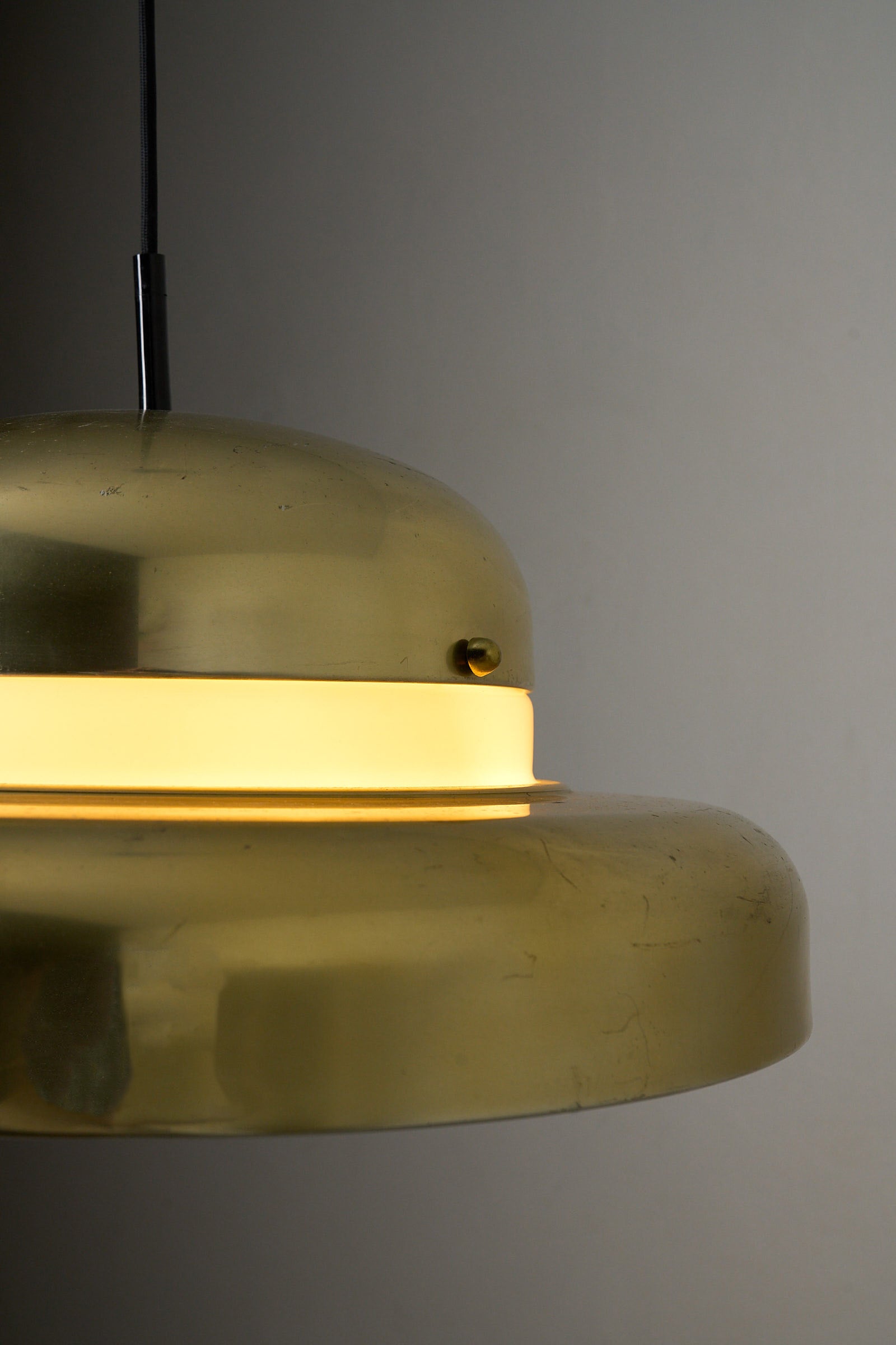 Large Brass and Yellow Glass Pendant showcasing elegant design and soft ambient glow.