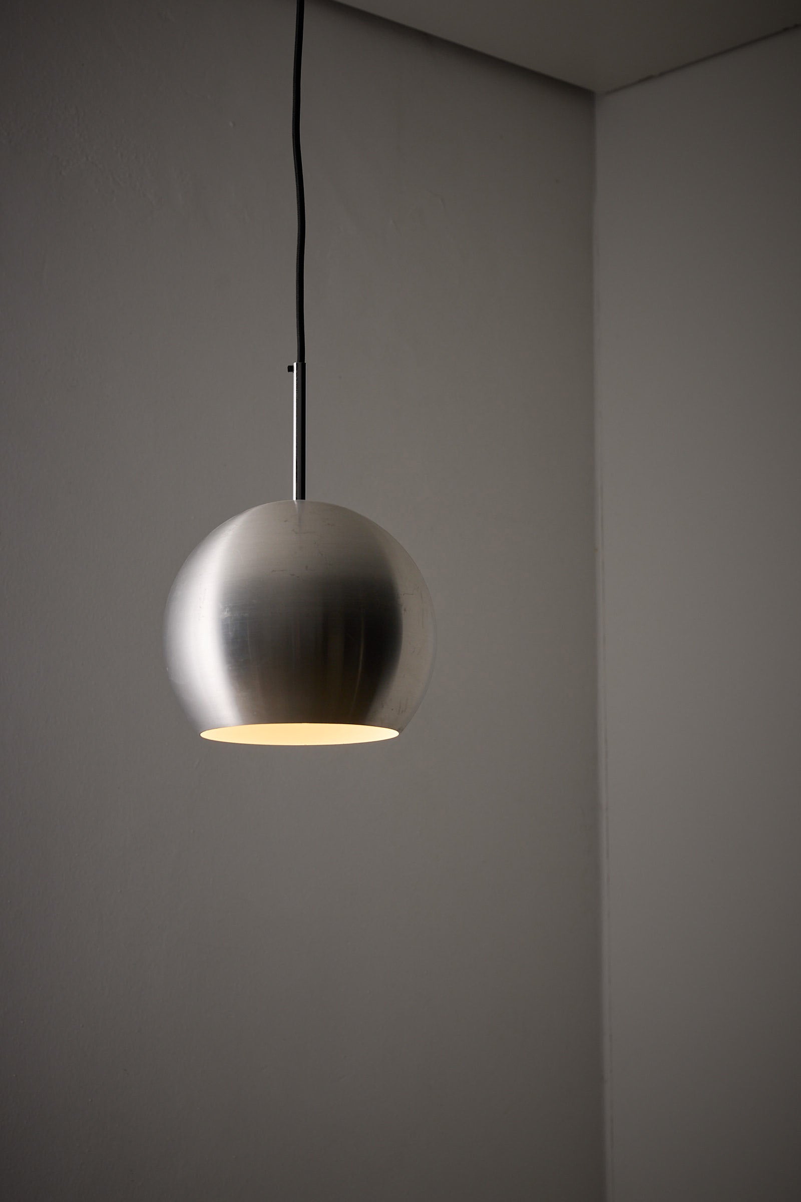 Brushed Aluminium Sphere Pendant by Cosack, Germany, 1960s hanging in a minimalist setting.