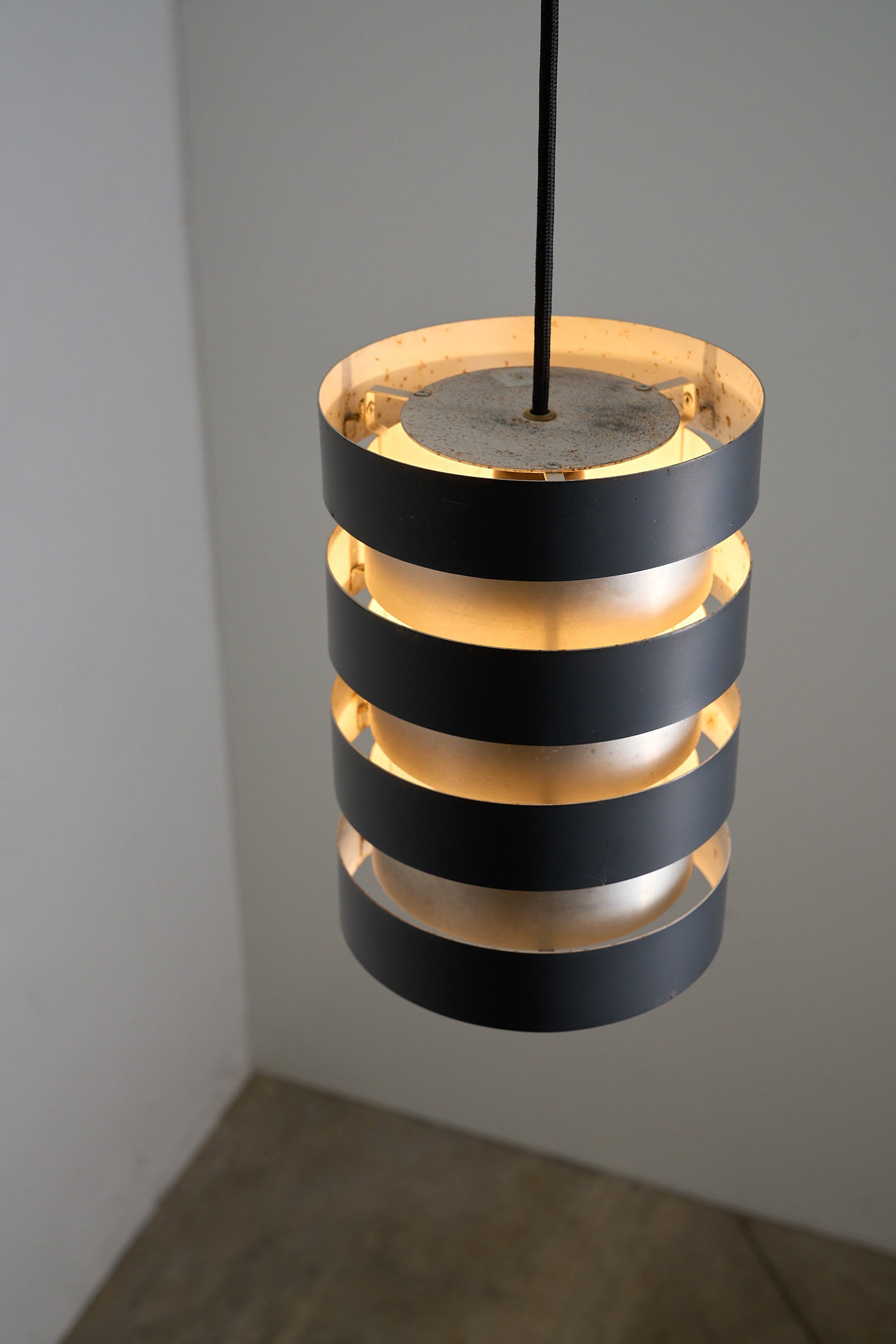 Fog & Mørup “Eiffel” Pendant by Jo Hammerborg, Denmark, 1960s featuring a cylindrical aluminium shade.