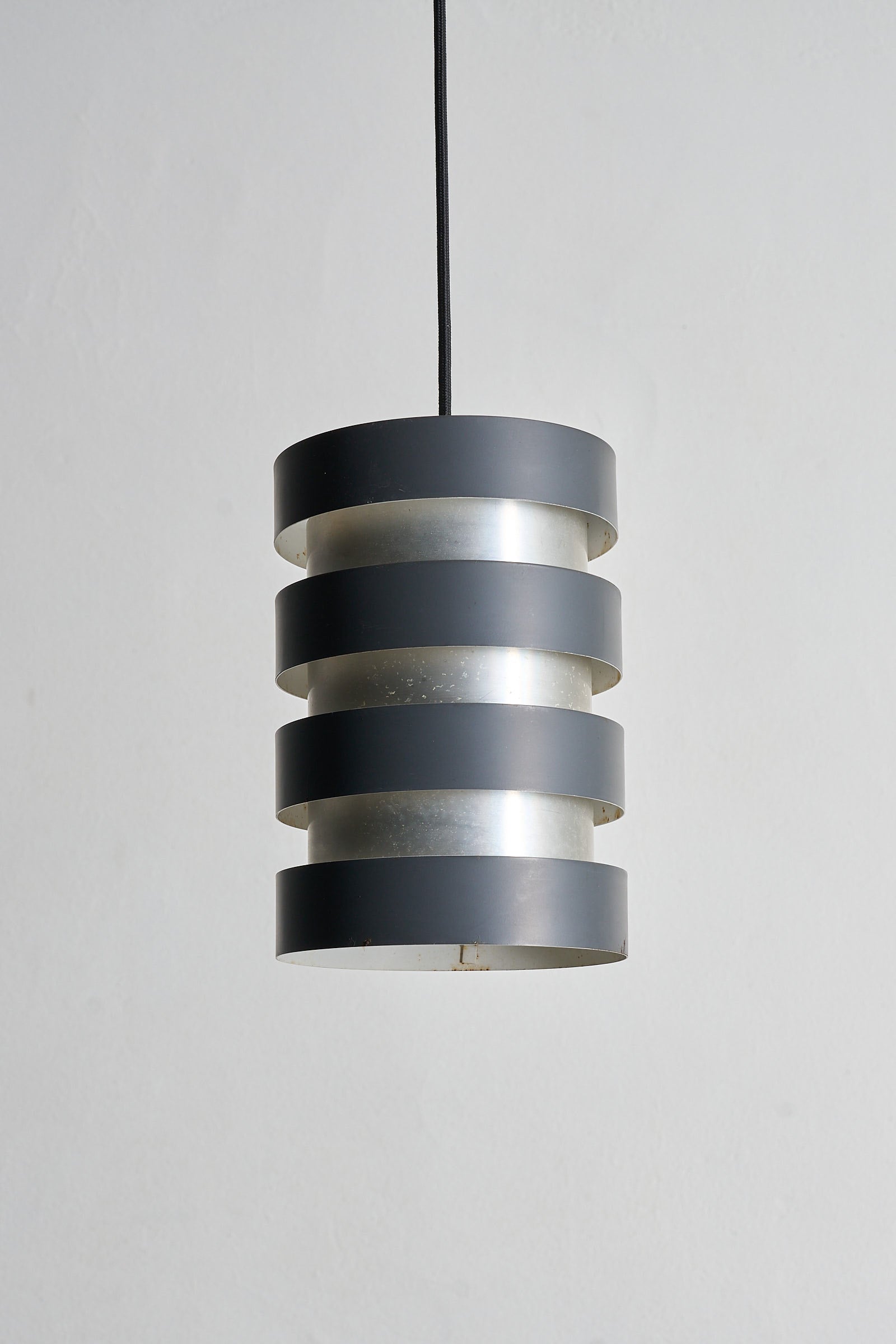 Fog & Mørup “Eiffel” Pendant by Jo Hammerborg, Denmark, 1960s, featuring alternating black and brushed aluminum rings.