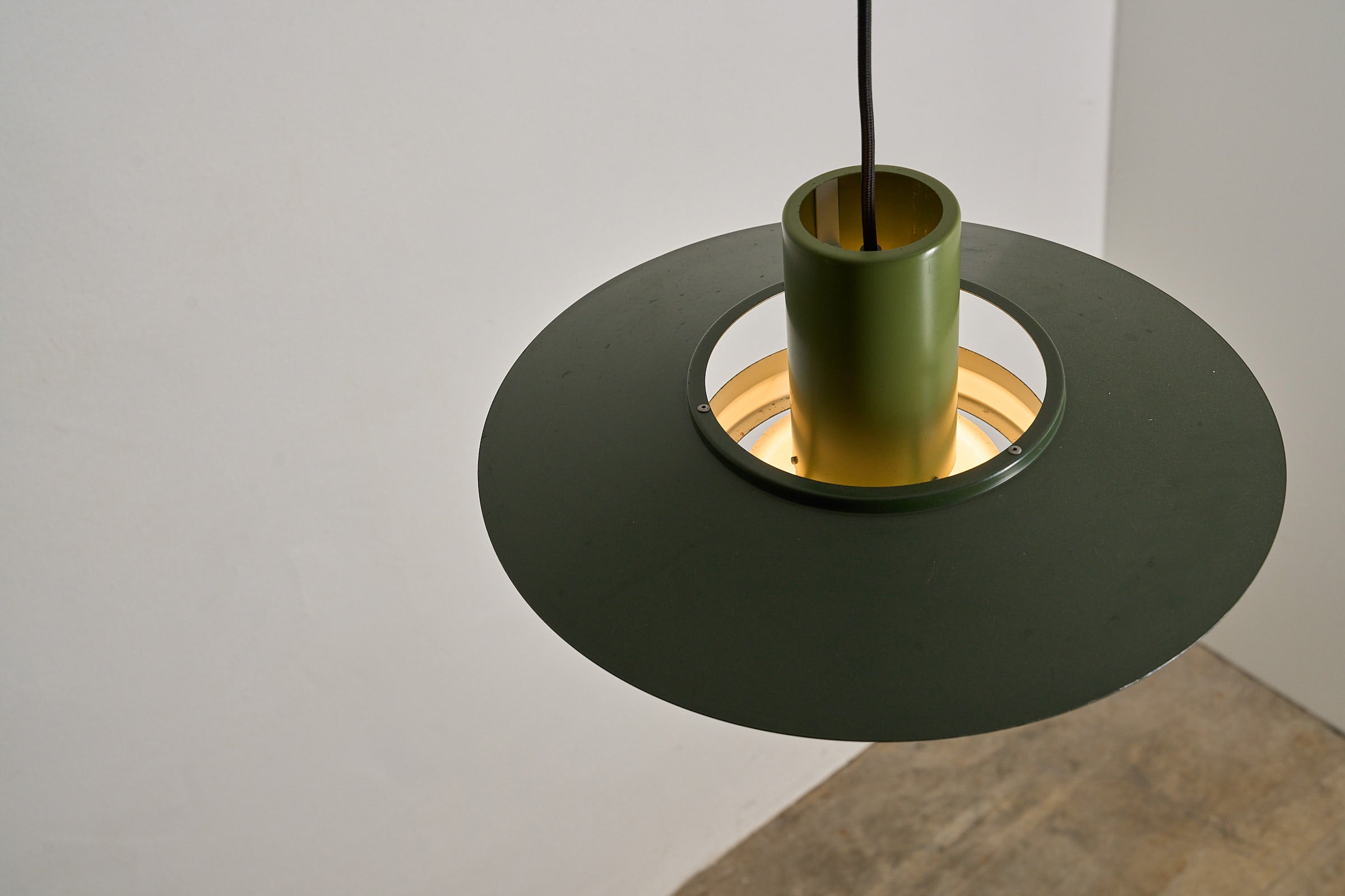 Vintage Green Falcon Pendant Light by Andreas Hansen for Fog & Mørup, showcasing its layered aluminum shade and sculptural design.