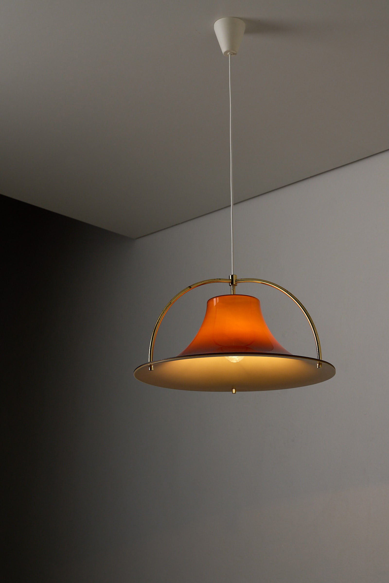 Fog & Mørup “Single” Pendant Lamp by Jo Hammerborg, 1970s with a caramel brown shade and brass arches.