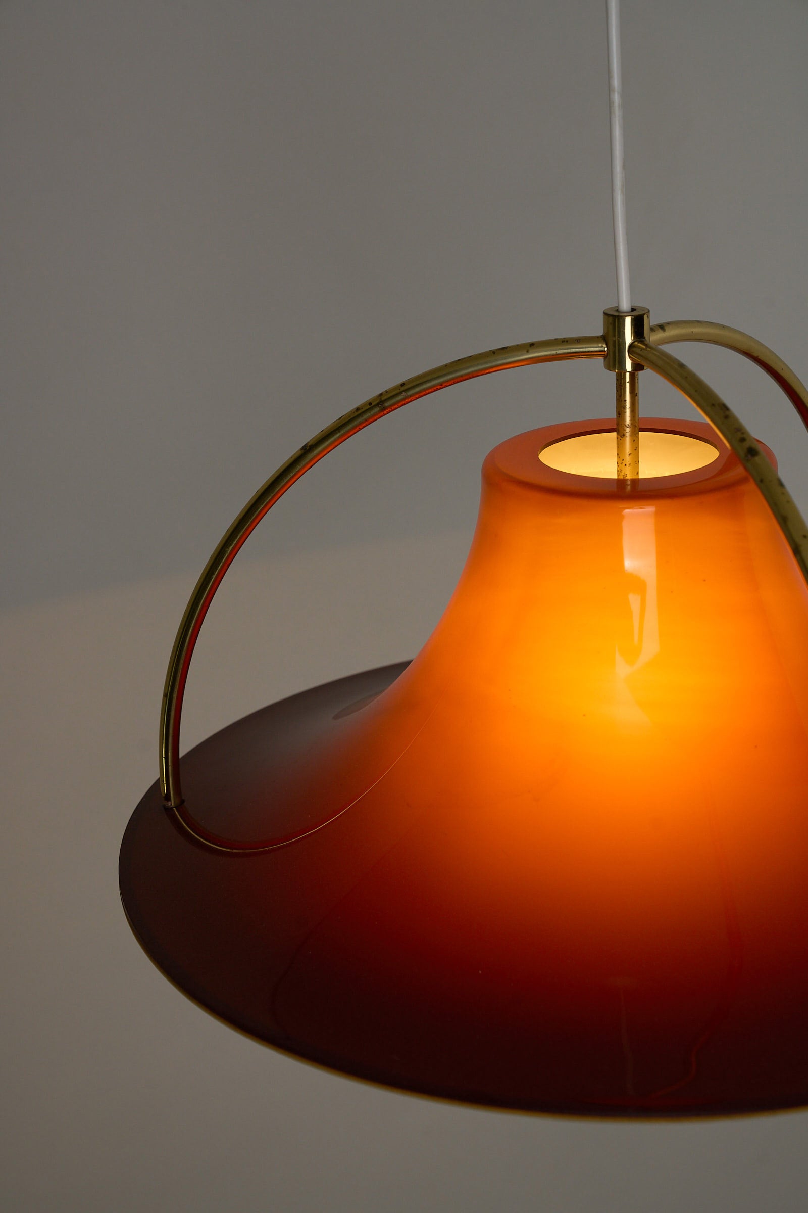 Fog & Mørup “Single” Pendant Lamp by Jo Hammerborg, 1970s showcasing warm caramel tones and brass details.