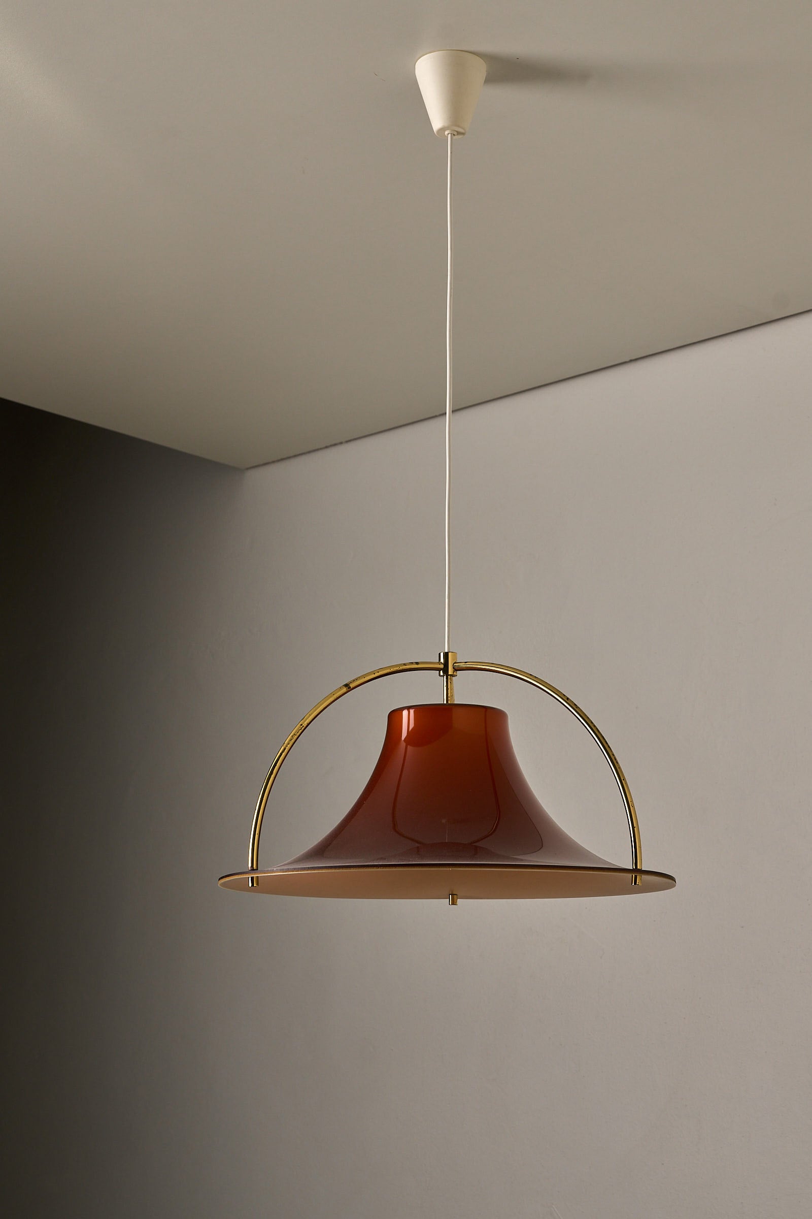 Fog & Mørup “Single” Pendant Lamp by Jo Hammerborg, 1970s with a caramel shade and brass arches.
