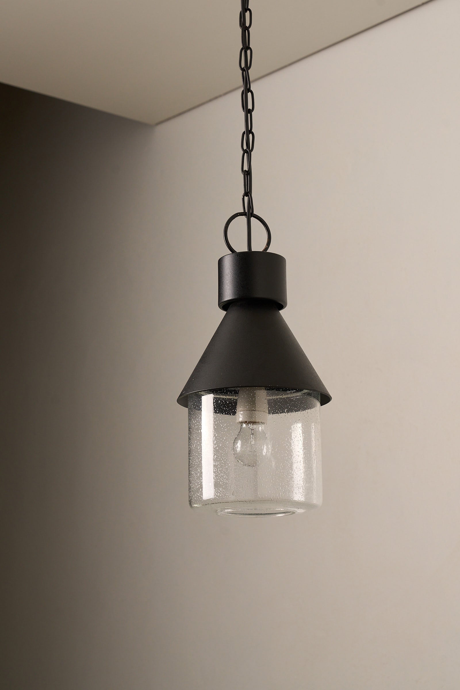 BOOM Ceiling Lamp, Black Metal & Bubble Glass Pendant with textured black metal frame and bubble glass diffuser.