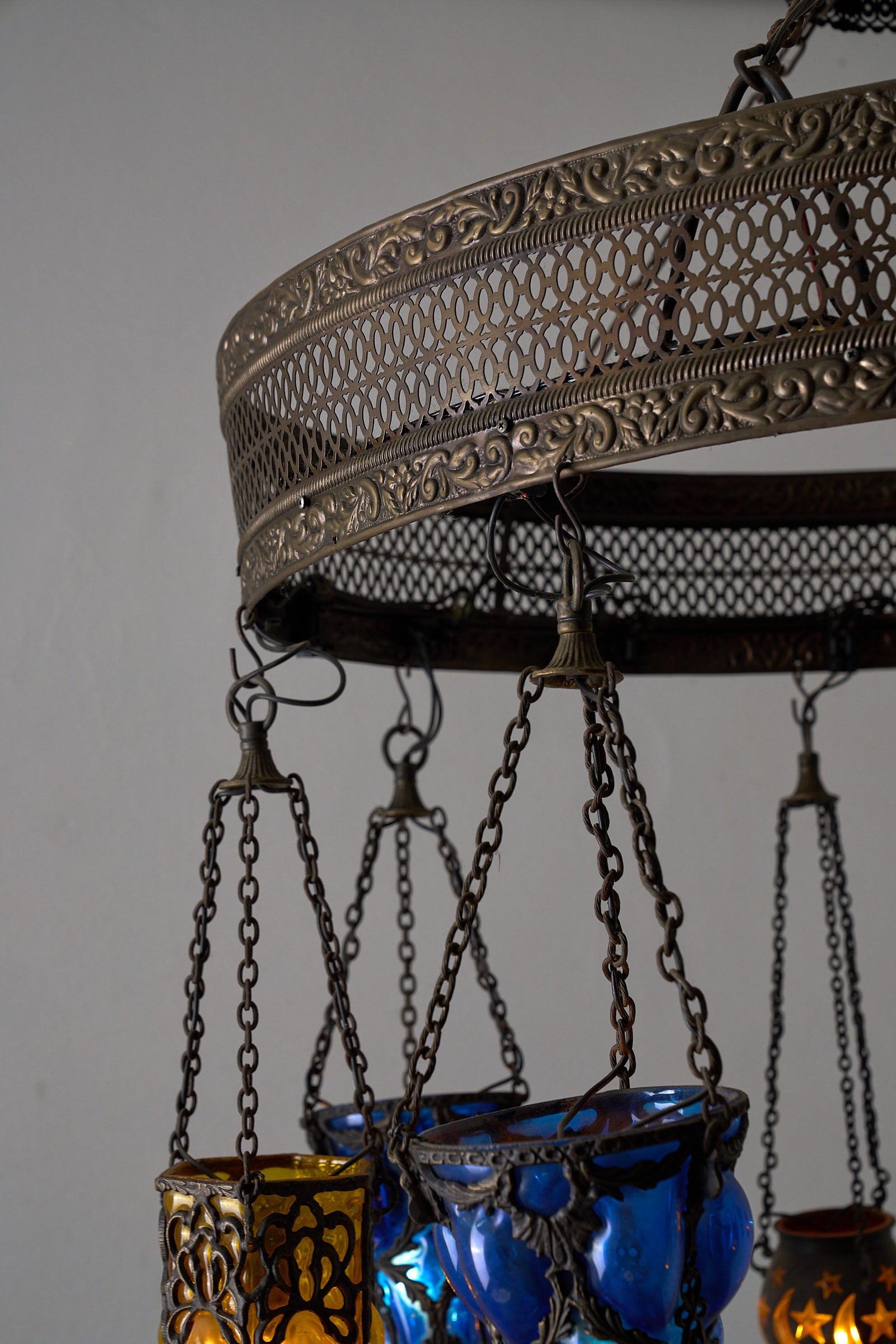 Moroccan Chandelier with Six Colored Glass Pendants featuring intricate brasswork and vibrant glass lanterns.