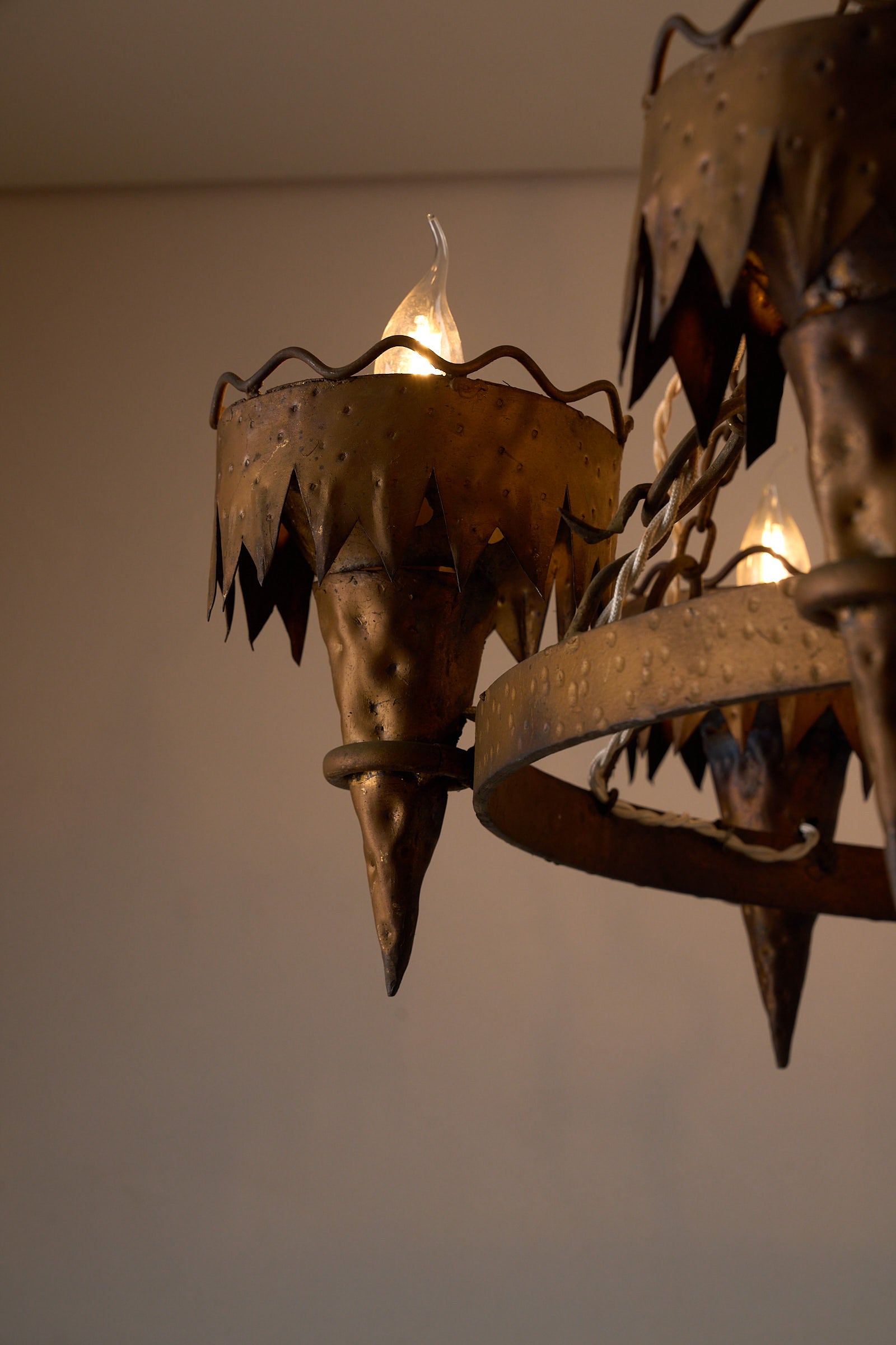 Wrought Iron Chandelier with Six Torch-Shaped Lights, 20th Century close-up of torch-shaped light fittings.