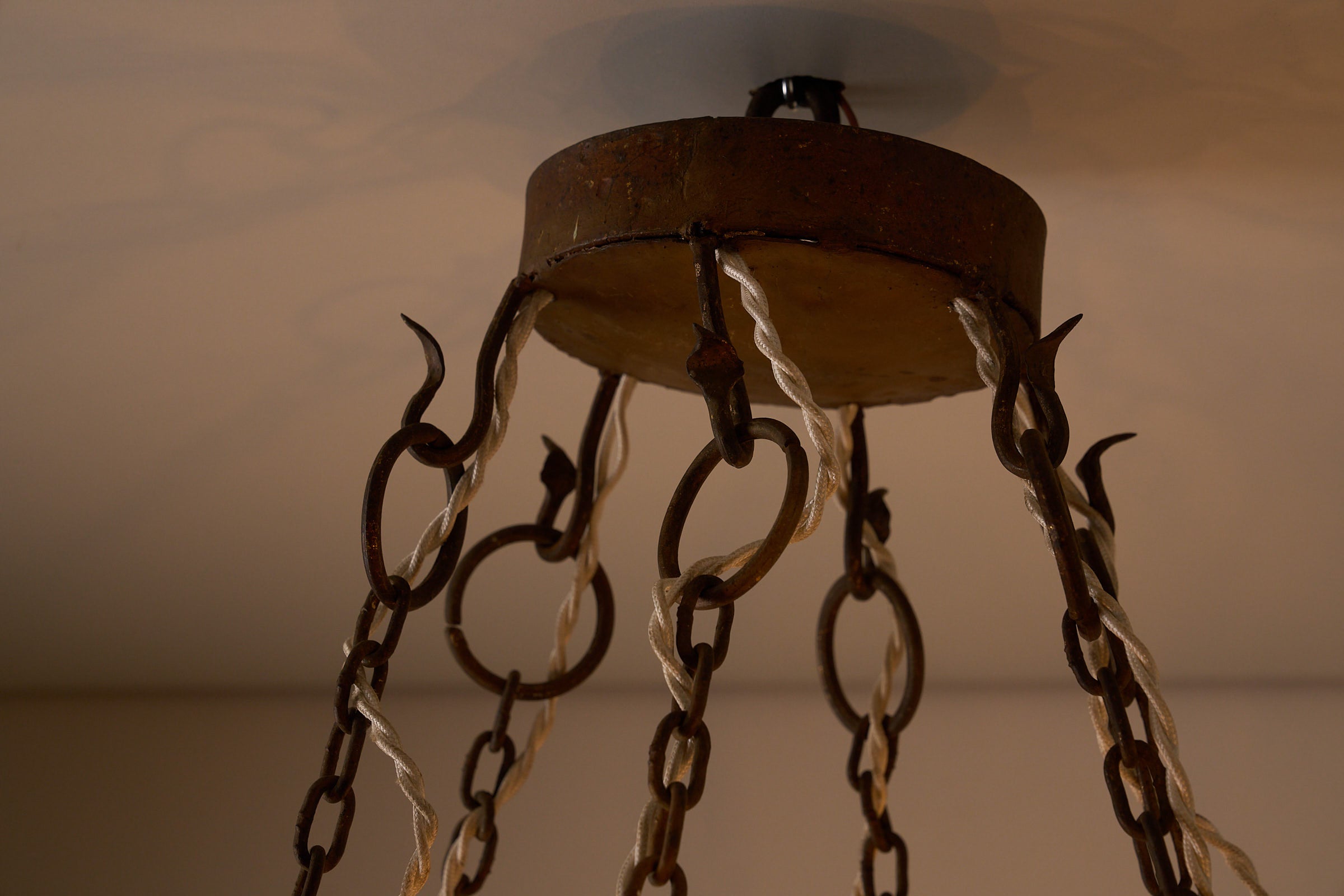 Wrought Iron Chandelier with Six Torch-Shaped Lights, 20th Century hanging detail with iron chains and fixture.
