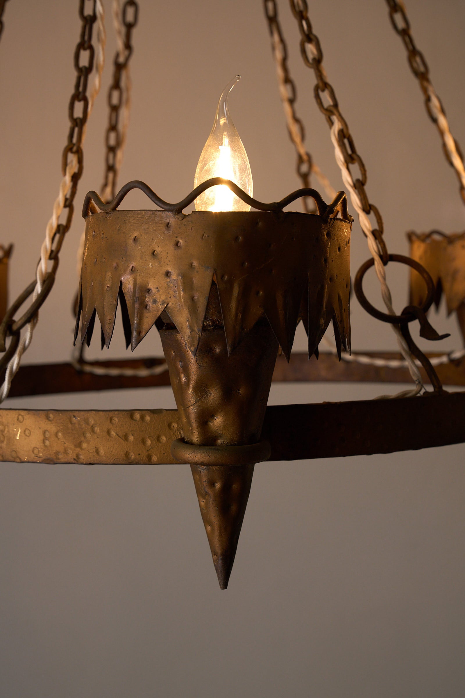 Wrought Iron Chandelier with Six Torch-Shaped Lights, 20th Century close-up of conical torch-shaped light fitting.
