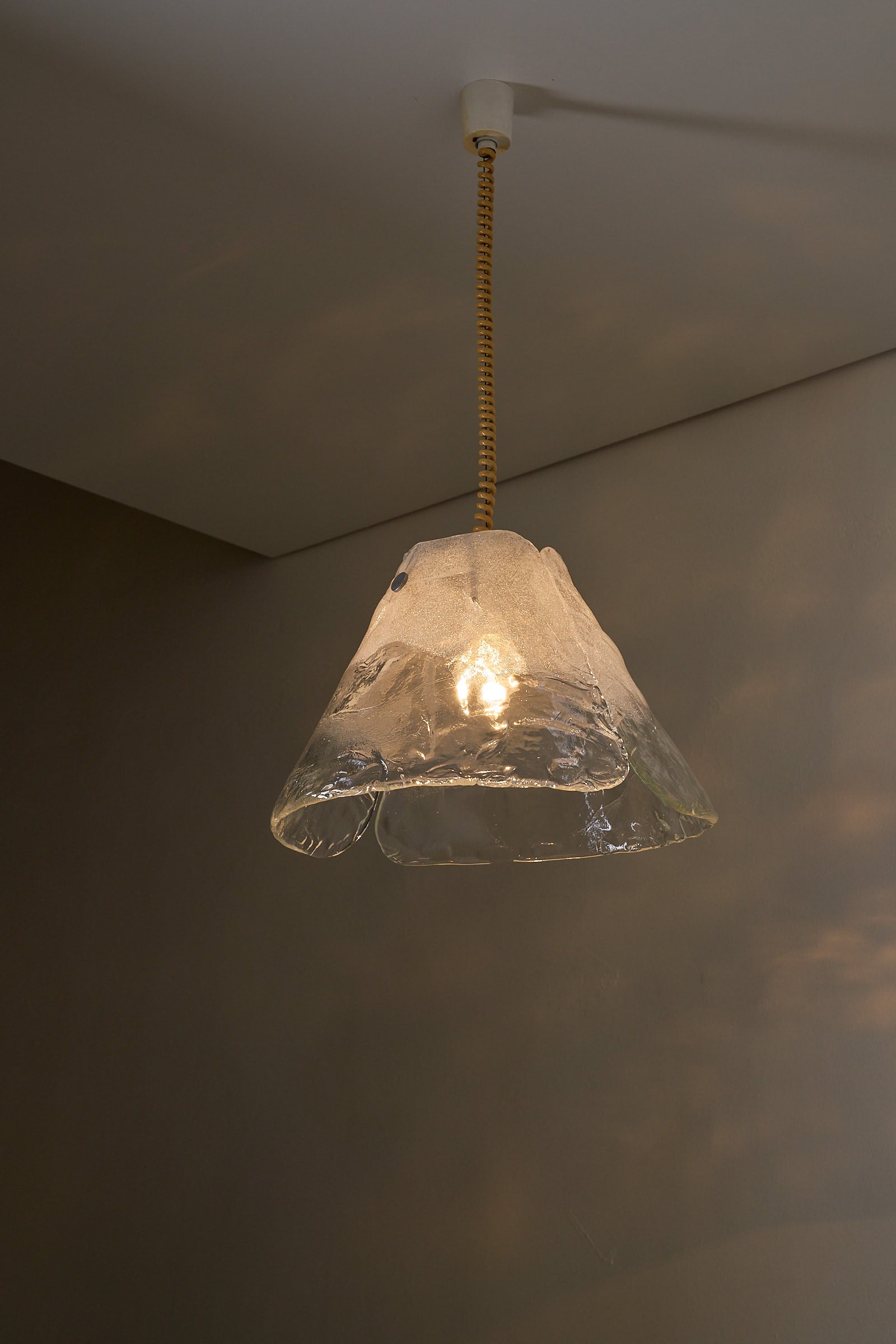 Carlo Nason Two-Panel Glass Chandelier featuring hand-blown Murano glass with a warm glow in a stylish setting.