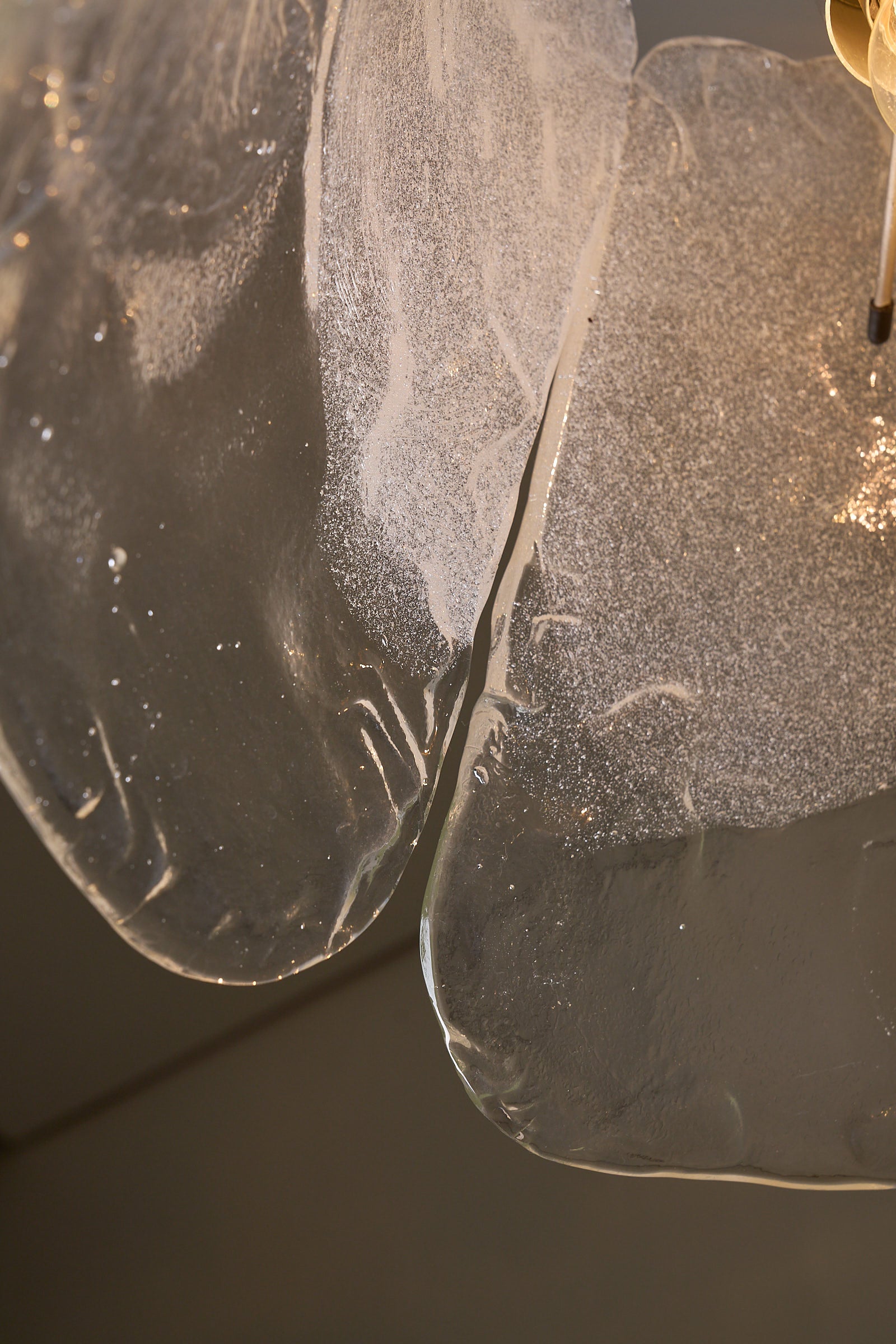 Close-up view of the Murano glass panels of the Carlo Nason Two-Panel Glass Chandelier, showcasing their unique texture.