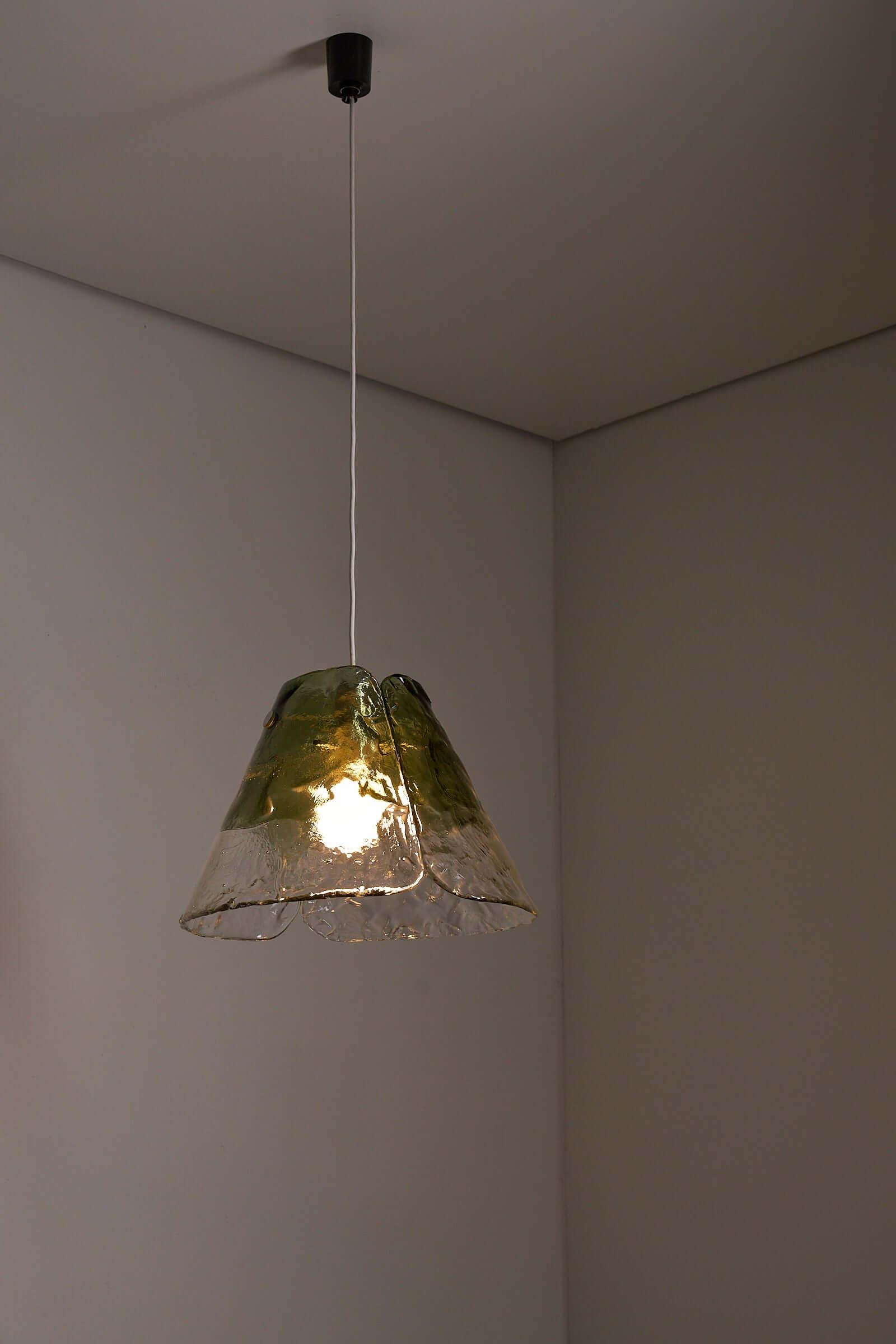 Carlo Nason Two-Tone Glass Chandelier, Moss-Green hanging in a minimalist interior, showcasing its unique Murano glass design.