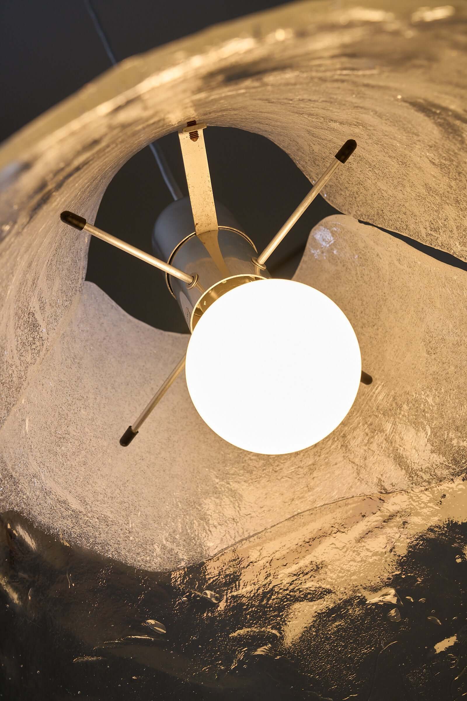 Carlo Nason Two-Tone Glass Chandelier, White showcasing a round bulb within a Murano glass shade.