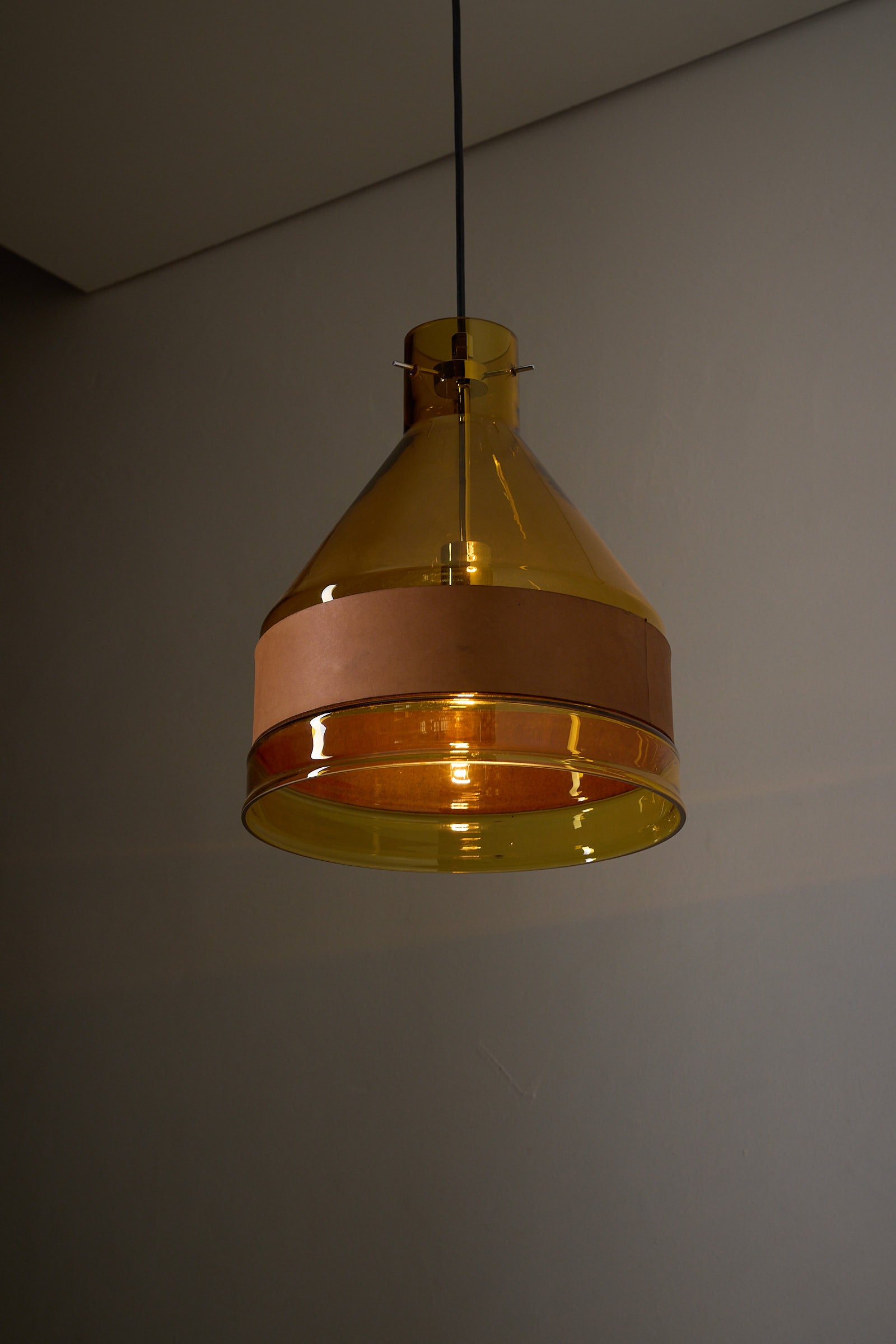 Amber Glass and Leather Pendant Lamp by J.T. Kalmar, 1970s hanging ceiling light with conical shape.