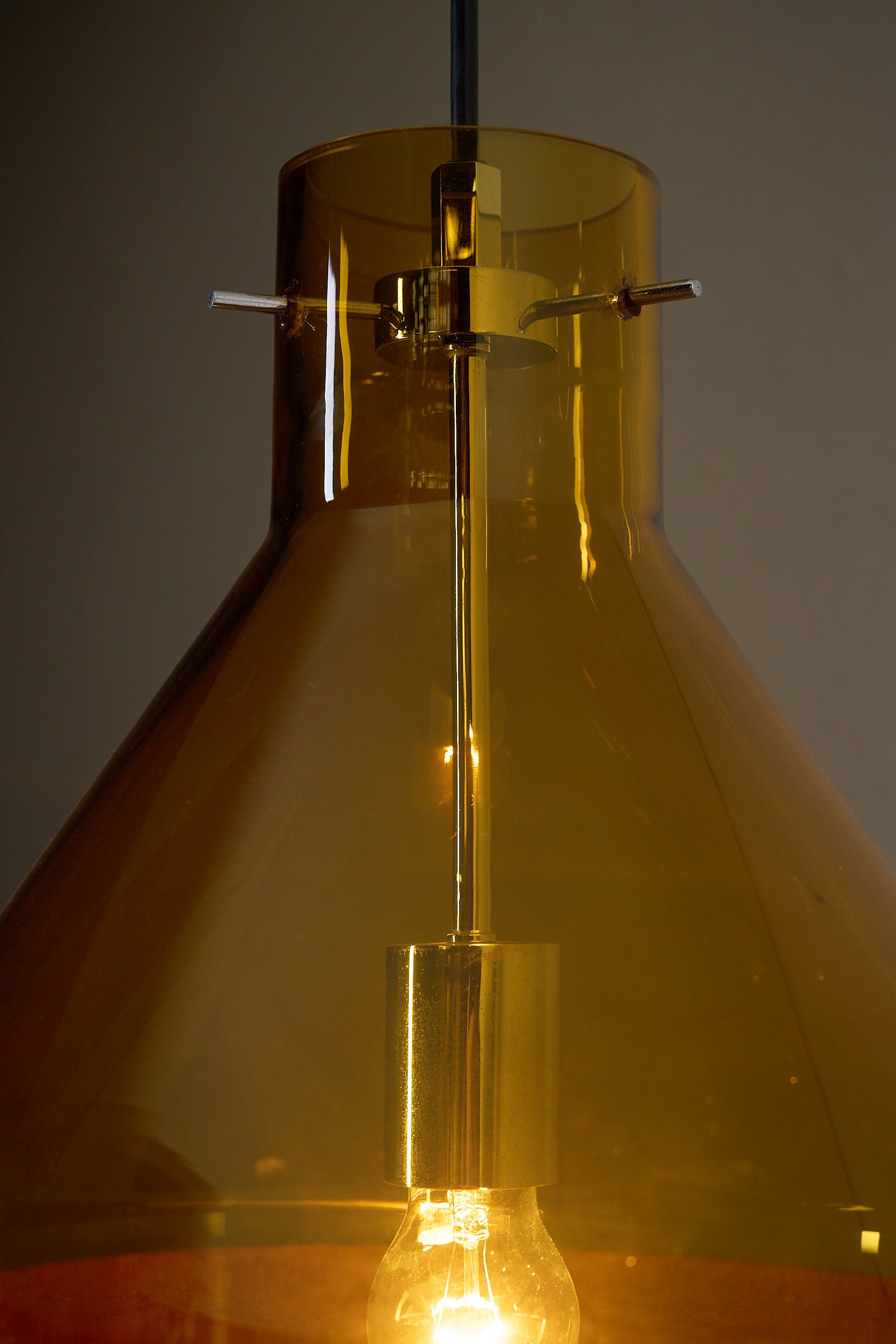 Amber Glass and Leather Pendant Lamp by J.T. Kalmar showcasing hand-blown amber glass shade and interior light.