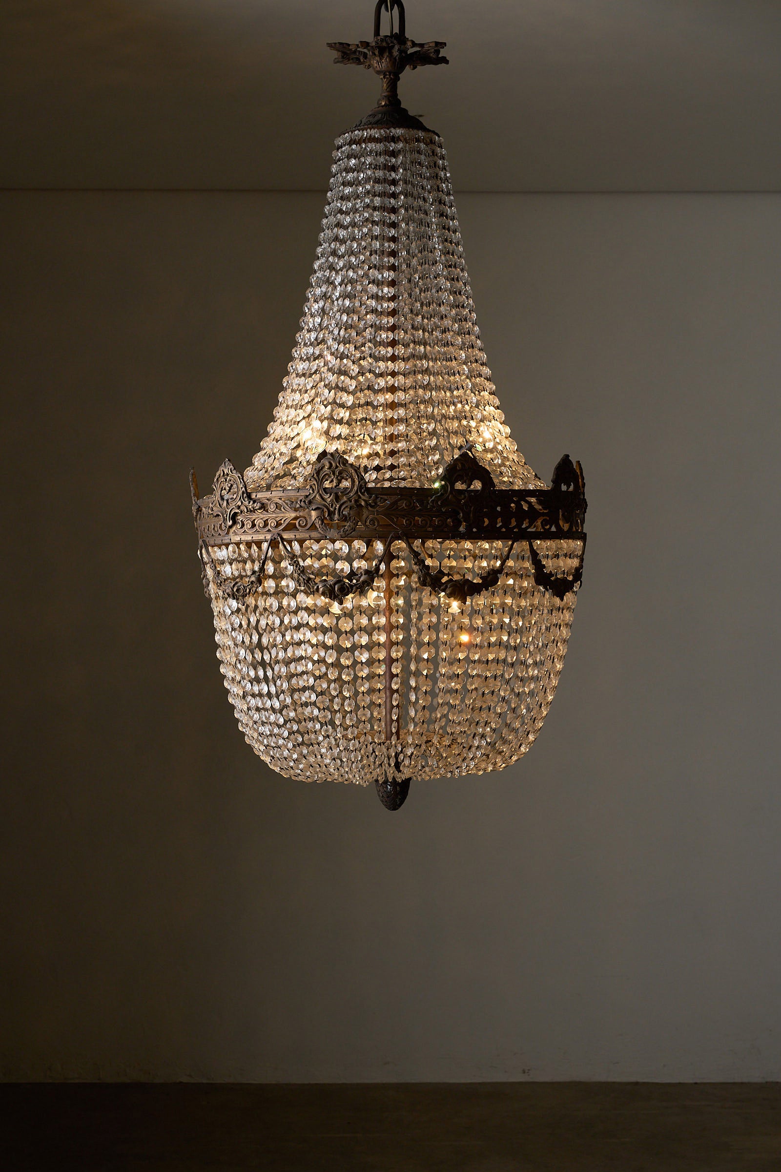 Crystal Basket Chandelier, France/Belgium, 20th Century with gilt bronze detailing and cascading crystal beads.