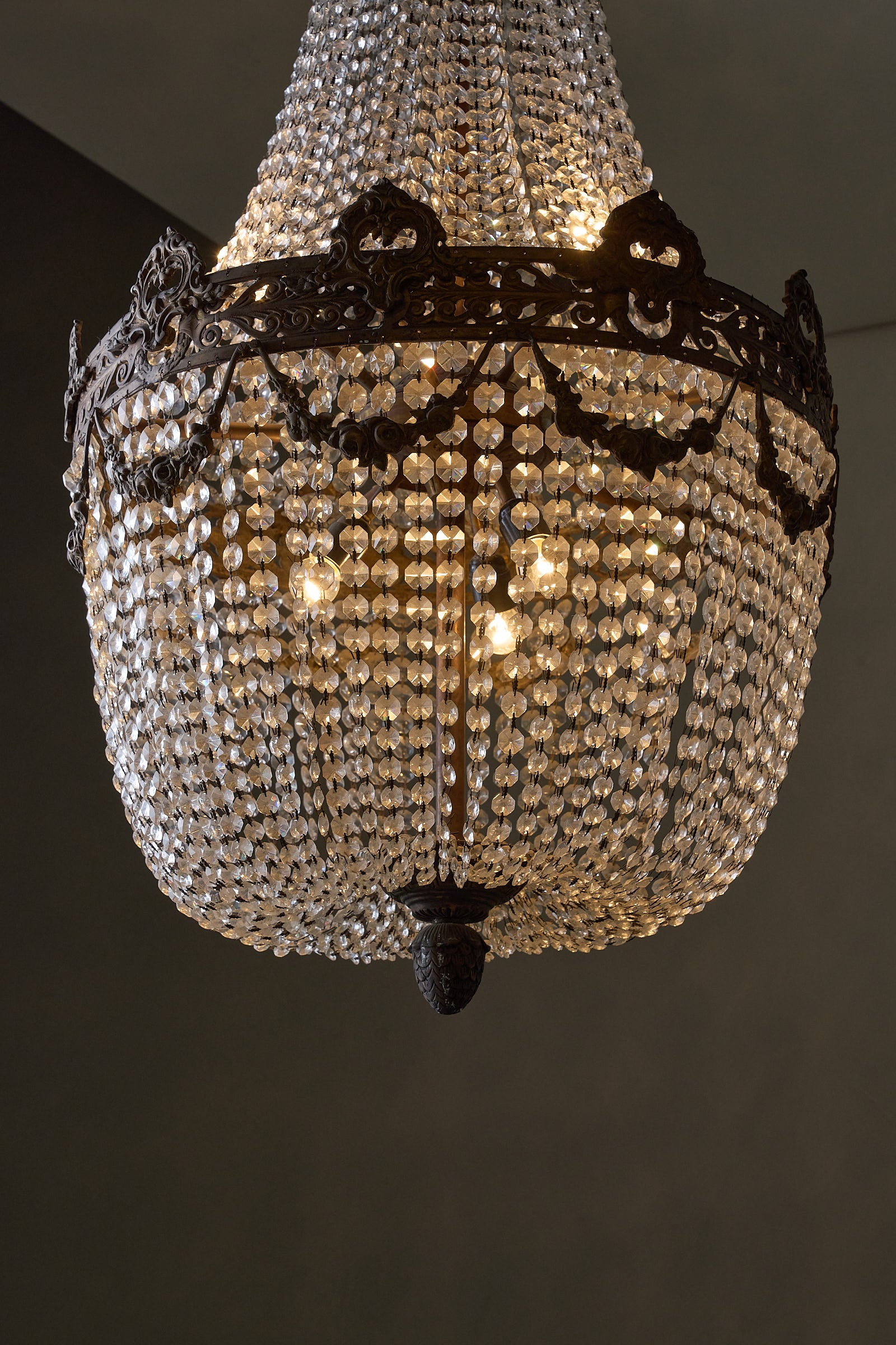 Crystal Basket Chandelier, France/Belgium, 20th Century with ornate gilt bronze and cascading crystal beads.