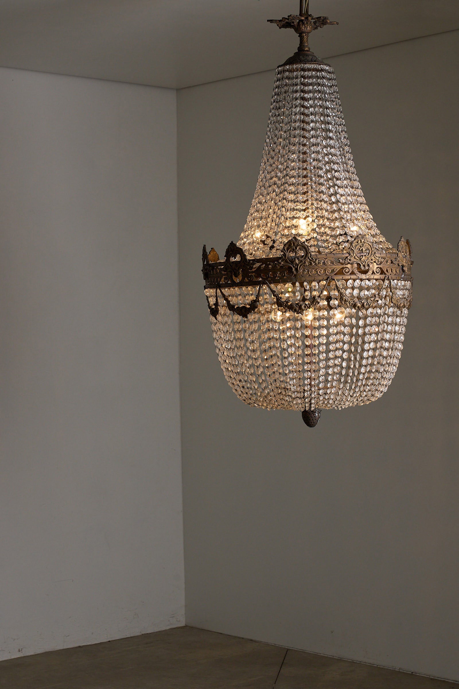 Crystal Basket Chandelier, France/Belgium, 20th Century with ornate gilt bronze and cascading crystal beads.