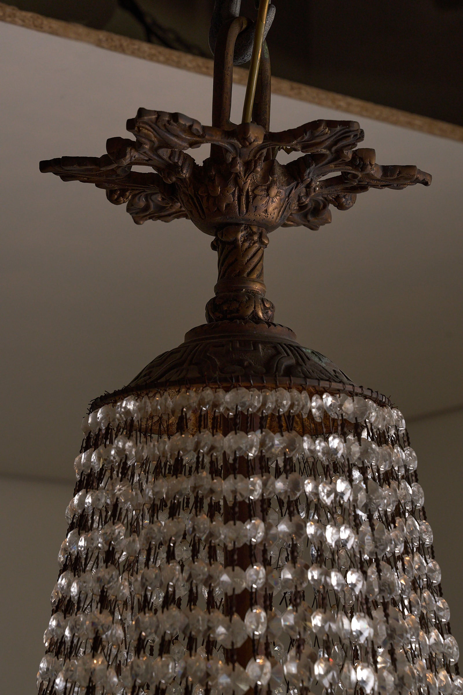 Crystal Basket Chandelier, France/Belgium, 20th Century with ornate gilt bronze detailing and cascading crystal beads.