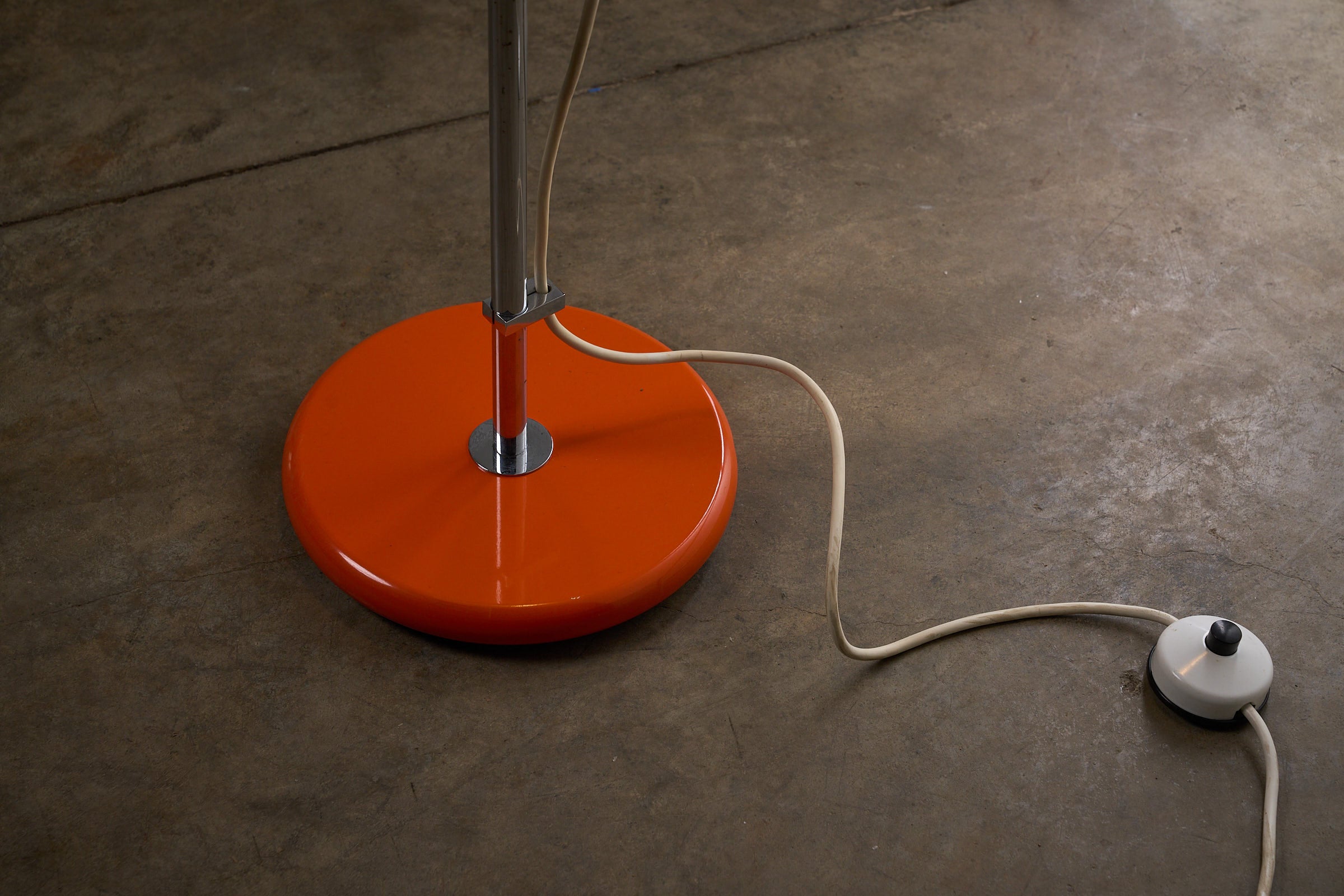 Close-up of the Orange Metal Sphere Floor Lamp by Cosack, Germany 1960s showing the base and cord.
