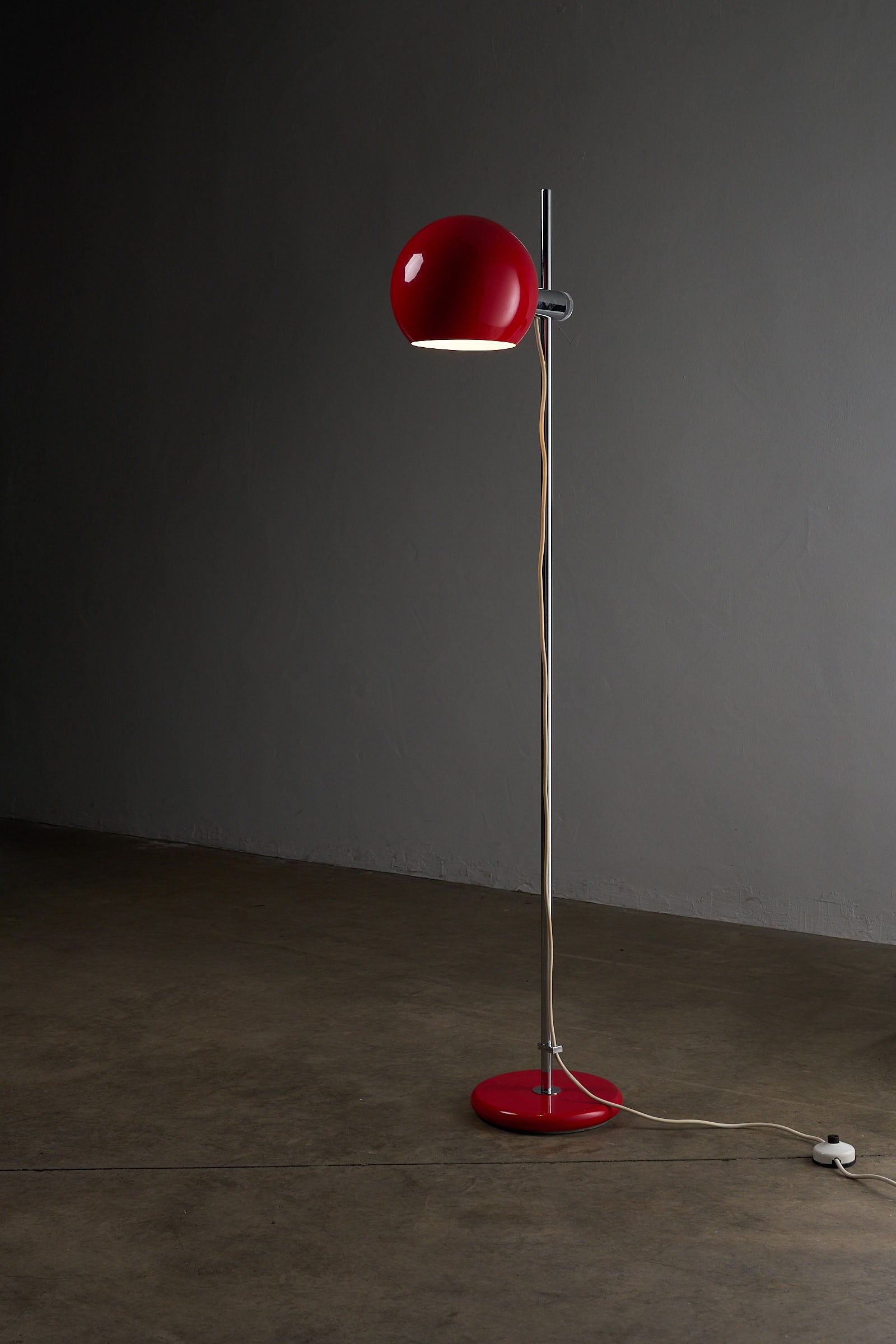 Red Sphere Floor Lamp by Cosack, Germany 1960s showcasing adjustable red shade and chrome-plated base.