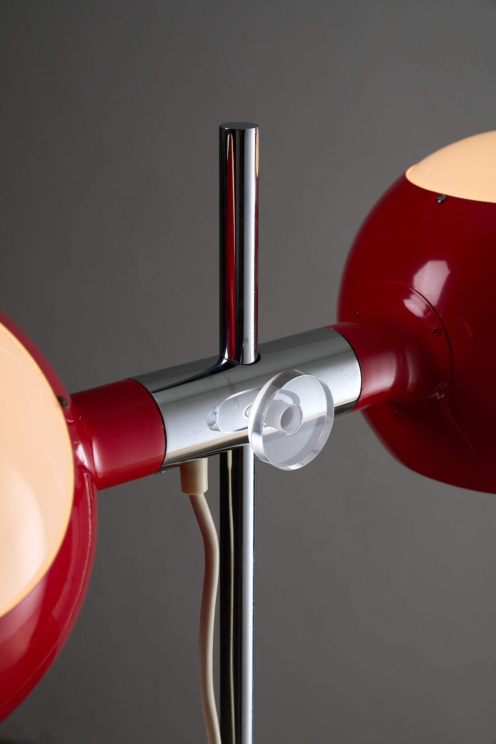 Close-up of Red Double-Sphere Floor Lamp with Diffuser showcasing chrome stem and adjusting knob.