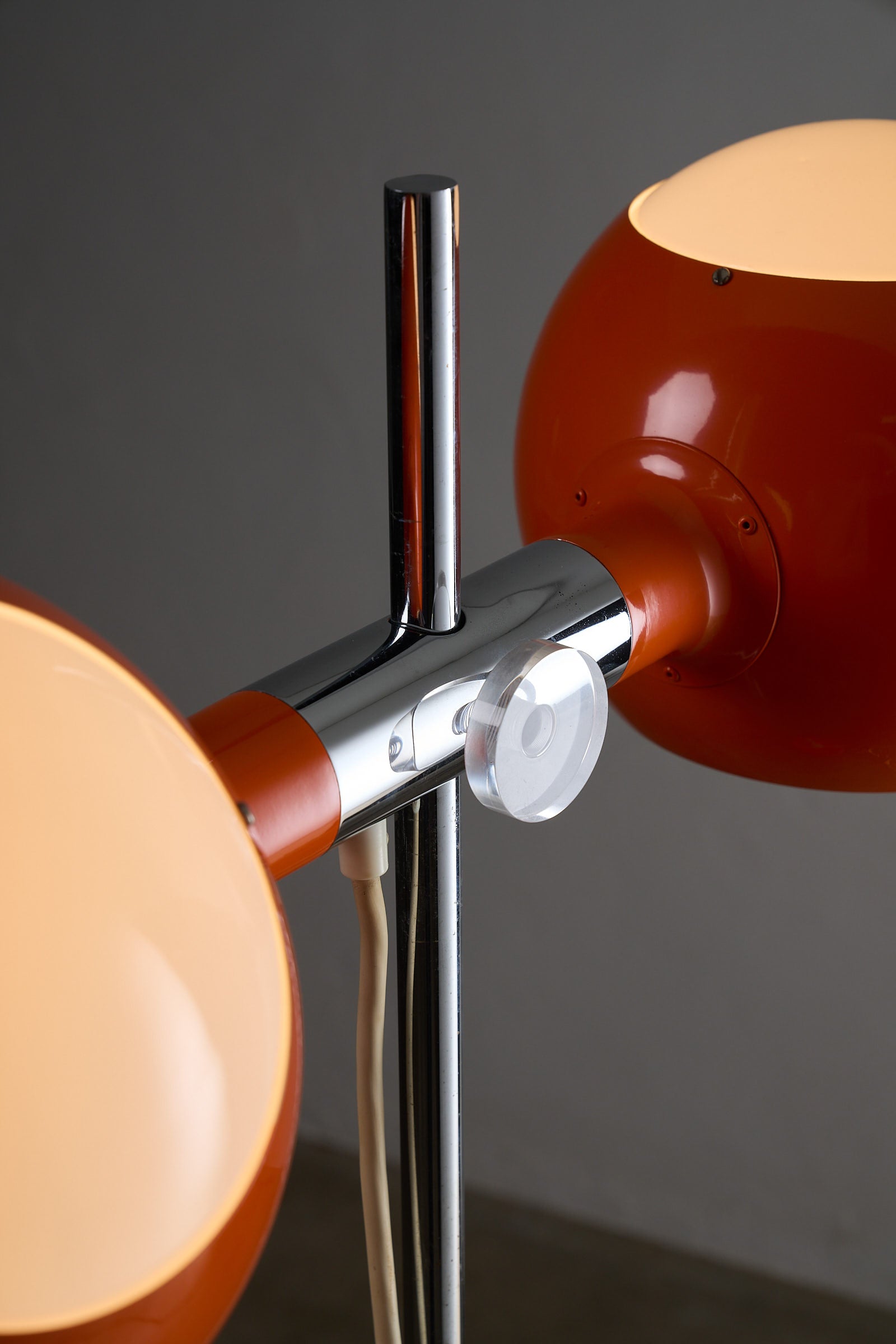 Close-up of the Orange Double-Sphere Floor Lamp with Diffuser showcasing the chrome stem and adjustable shades.