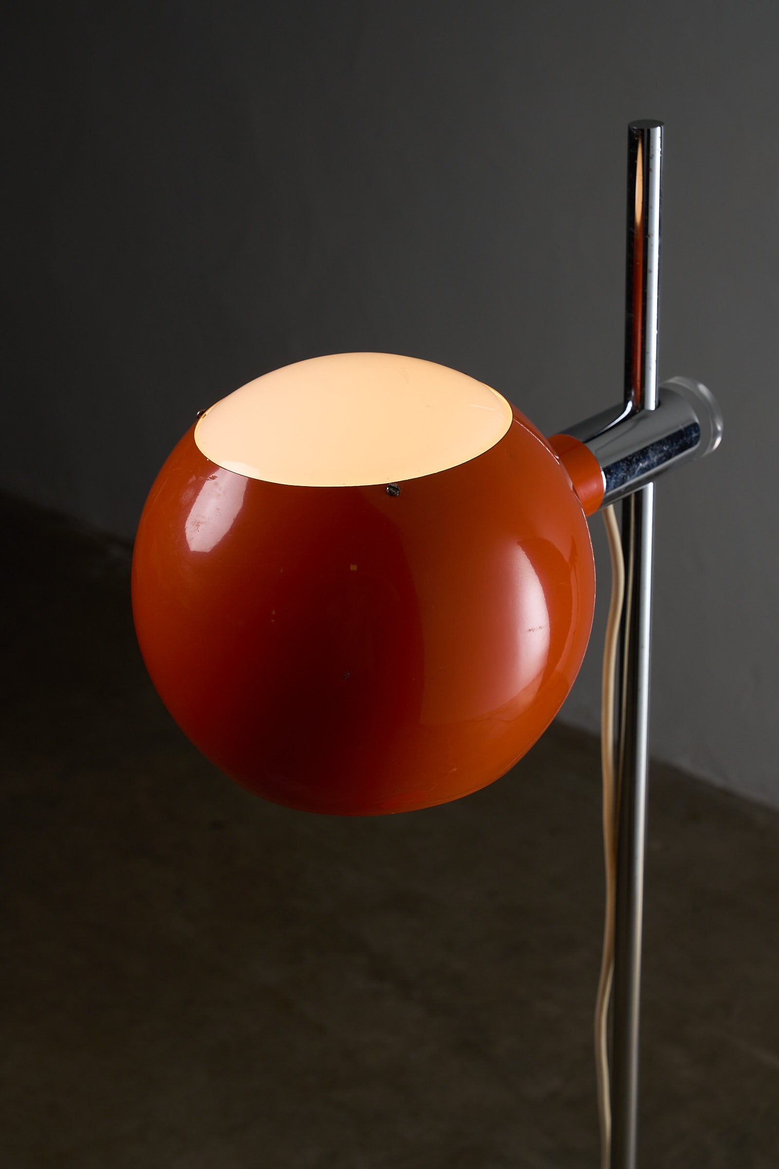 Orange Sphere Floor Lamp with Diffuser showcasing a lacquered metal sphere and chromed steel stem.