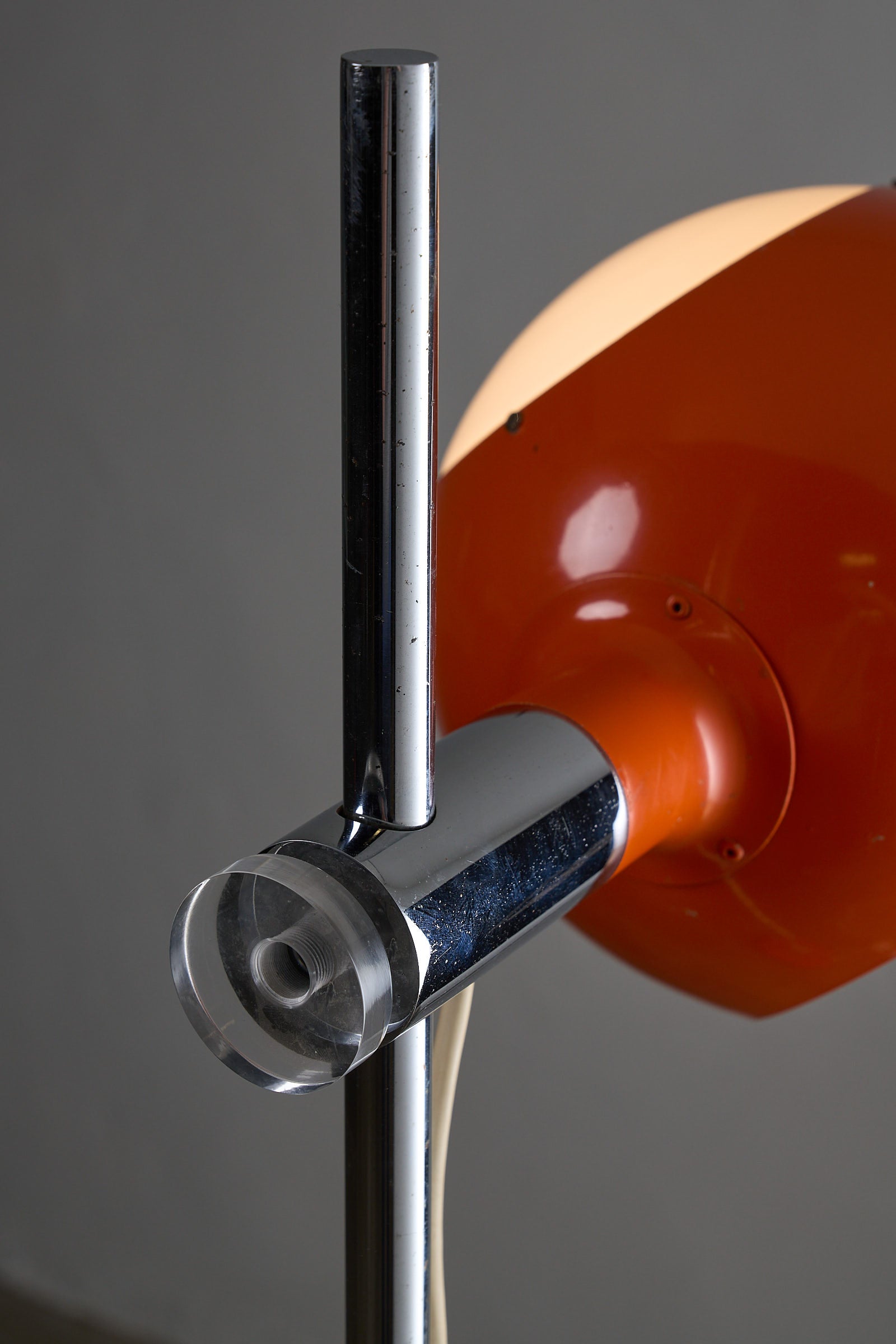 Close-up of the Orange Sphere Floor Lamp with Diffuser showcasing chrome stem and orange shade details.